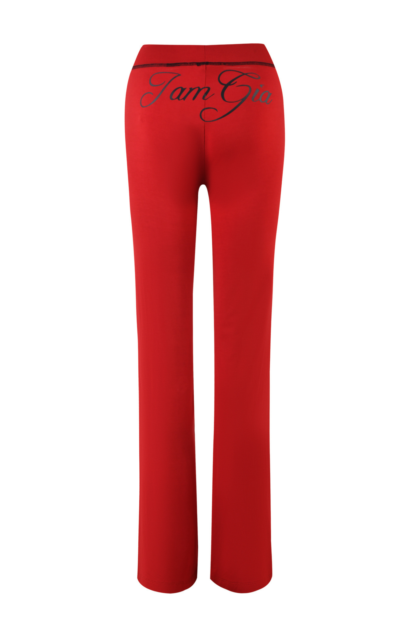 The BLARE TRACKPANT - RED by I.AM.GIA is shown from the back, featuring a high-waisted fit with flared legs and “I am Gia” in black script across the waistband. Crafted from soft bamboo fabric, these trackpants combine comfort and style.