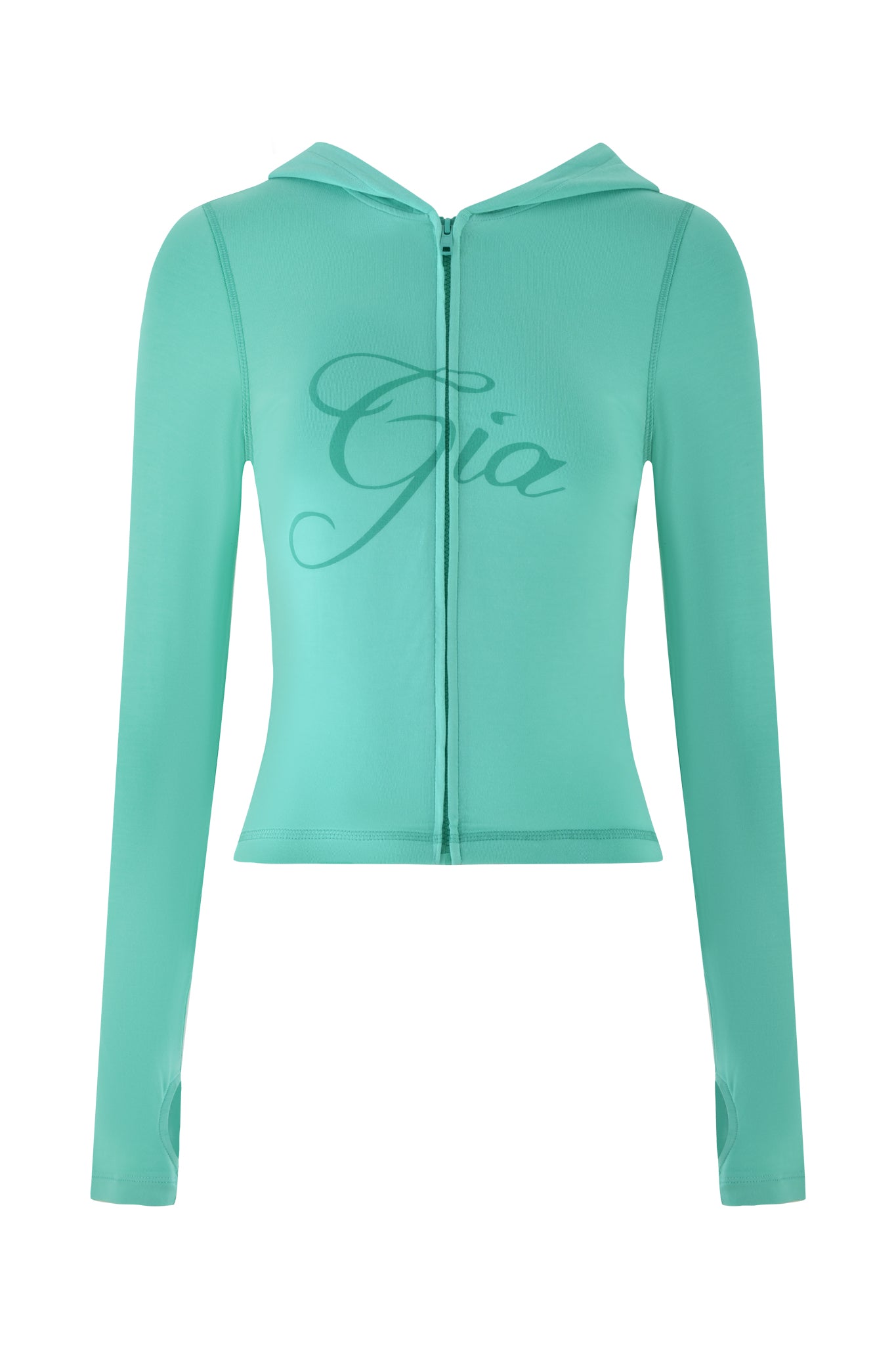 The BLARE HOODIE - GREEN : TURQUOISE : TEAL by I.AM.GIA is a turquoise-teal zip-up design featuring long sleeves with thumb holes and a sleek bodycon fit, adorned with "Gia" elegantly printed in cursive across the chest.