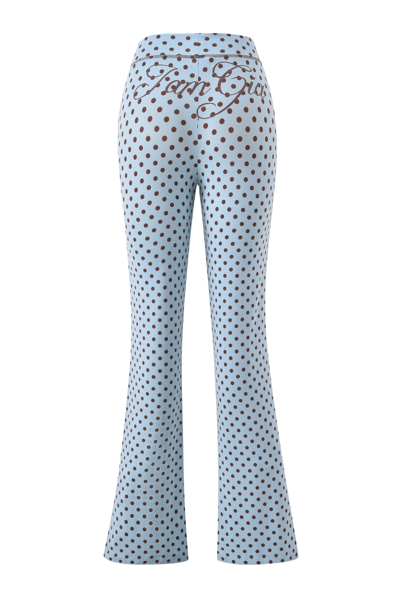 The I.AM.GIA BLARE TRACKPANT in blue features a light blue low-rise, flared fit with black polka dots and "Farm Girl" scripted across the back waistband.