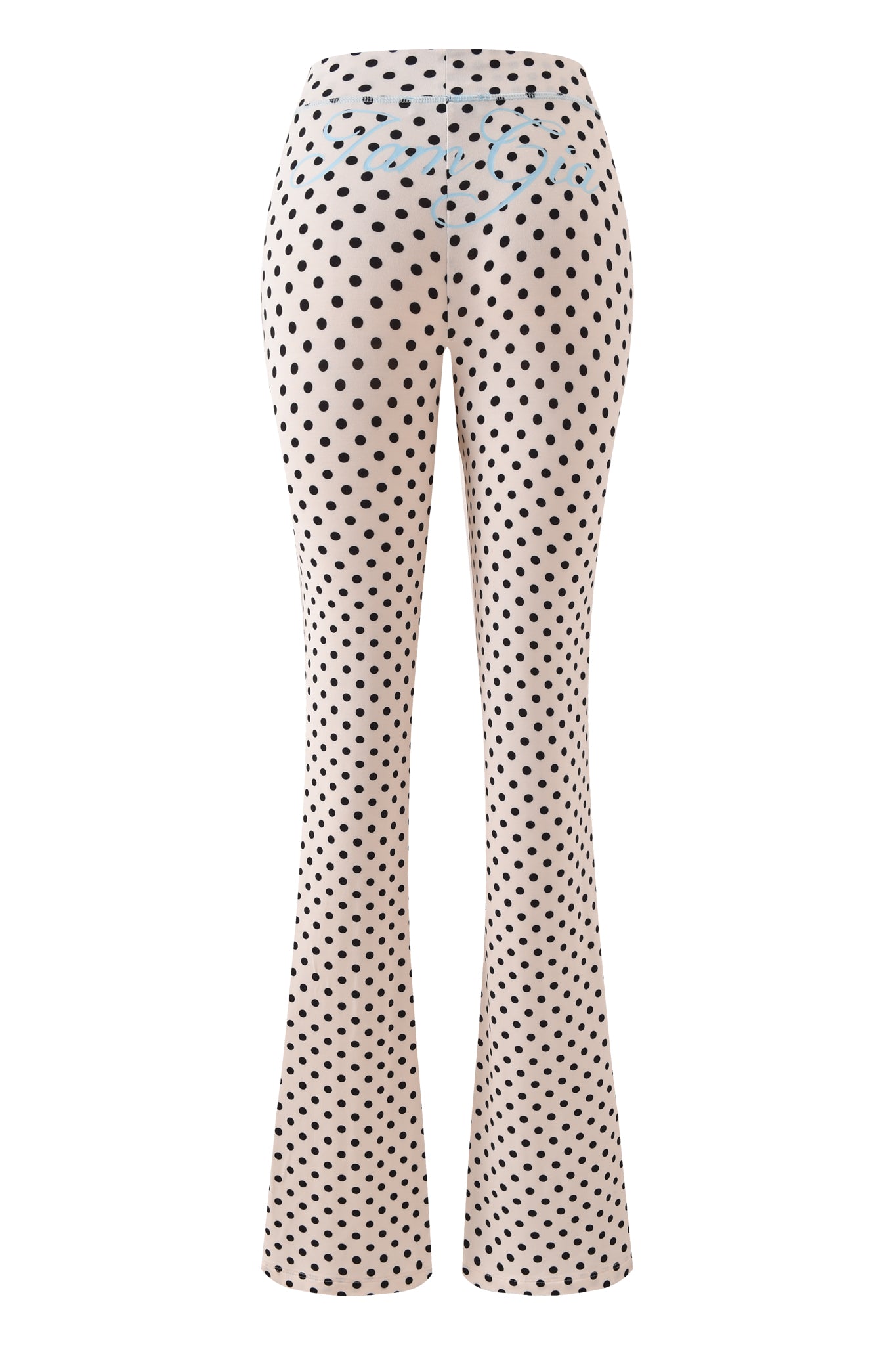 The BLARE TRACKPANT - CREAM POLKA DOT by I.AM.GIA features a high-waisted fit, black polka dot print on cream, and stylish flared legs, shown from the back.