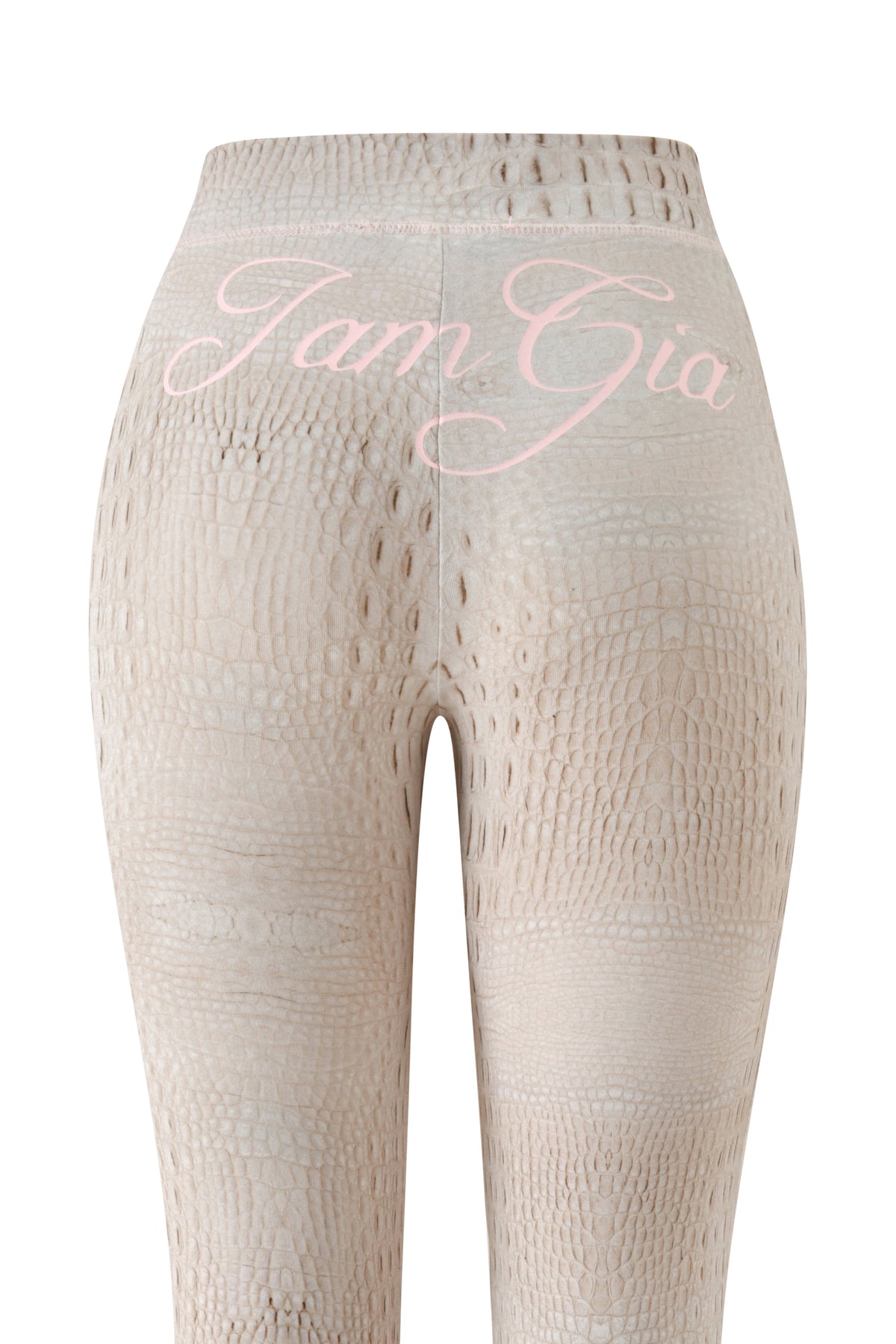 Beige BLARE TRACKPANT - HOT CROC leggings by I.AM.GIA, featuring a crocodile skin pattern in the Hot Croc print, shown from the back with “I.AM.GIA” written in light pink script across the waistband.