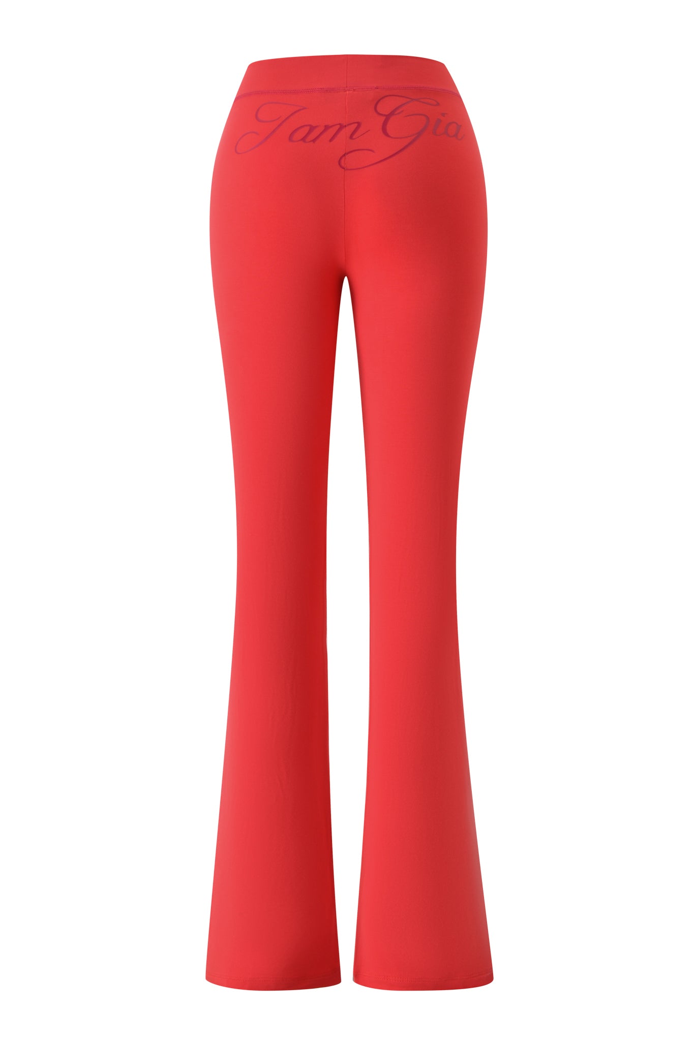 Papaya-colored BLARE TRACKPANT by I.AM.GIA shown from the back, featuring a high-waist flared leg and bold "I.AM.GIA" script across the waistband.
