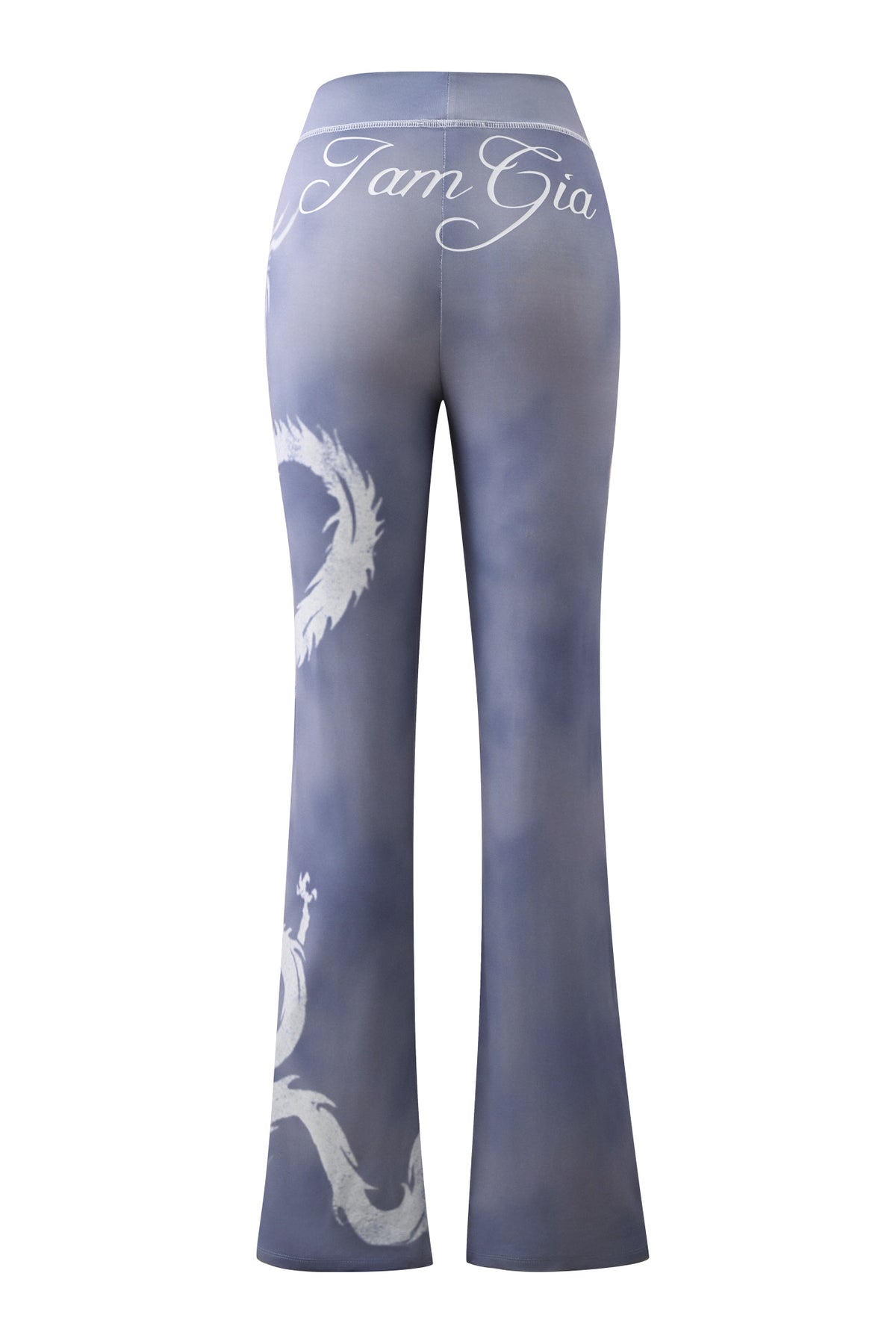 Back view of the BLARE TRACKPANT - STEEL BLUE DRAGON by I.AM.GIA, showcasing a high-waisted, flared silhouette with a bold white dragon graphic and “I.AM.GIA” cursive branding across the waistband.