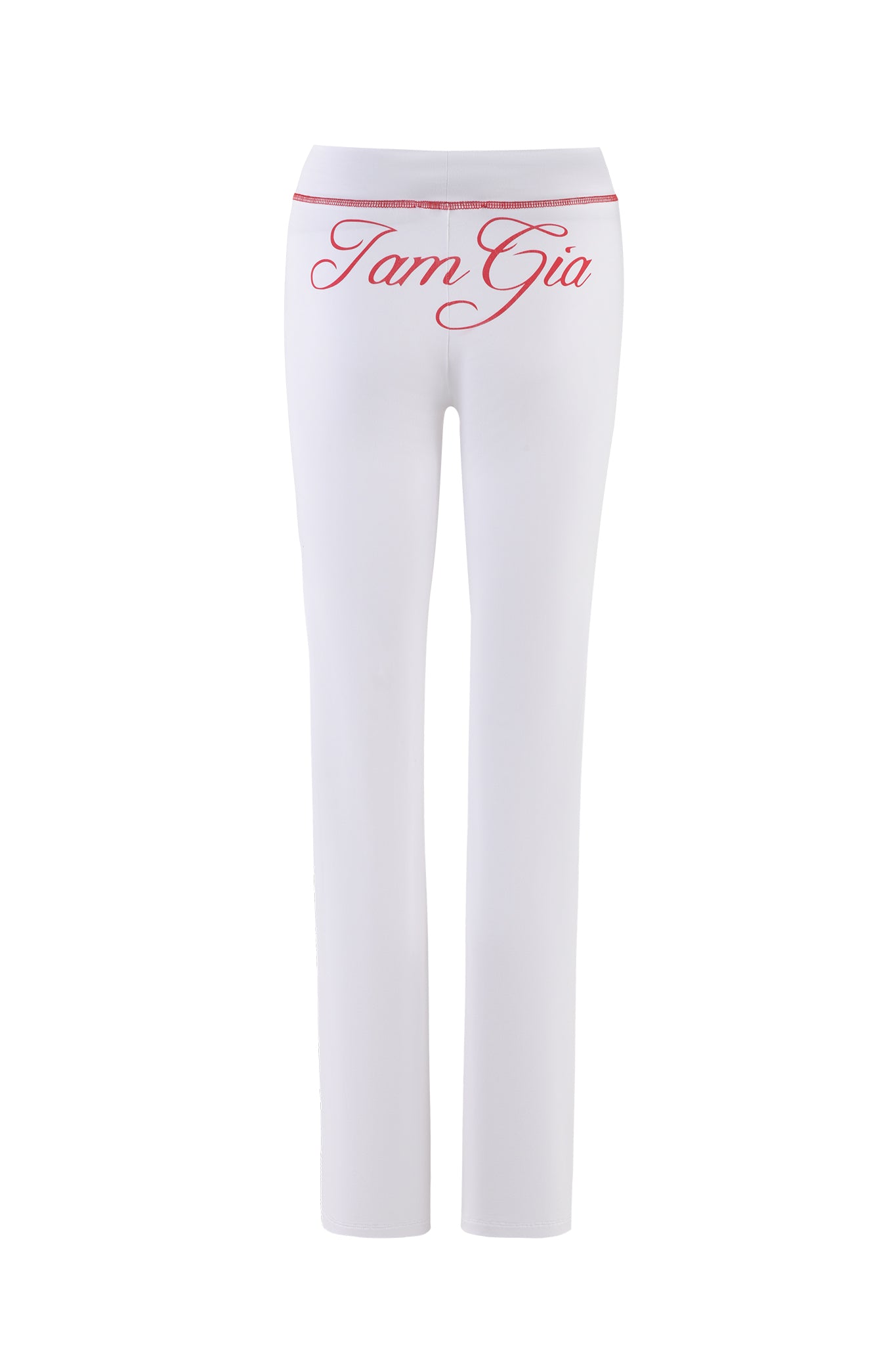 The BLARE TRACKPANT - WHITE by I.AM.GIA features a sleek, slim-fitting design with a high waist. It is crafted from stretchy bamboo and jersey fabric for added comfort and includes red cursive text "Tam Gia" on the back.