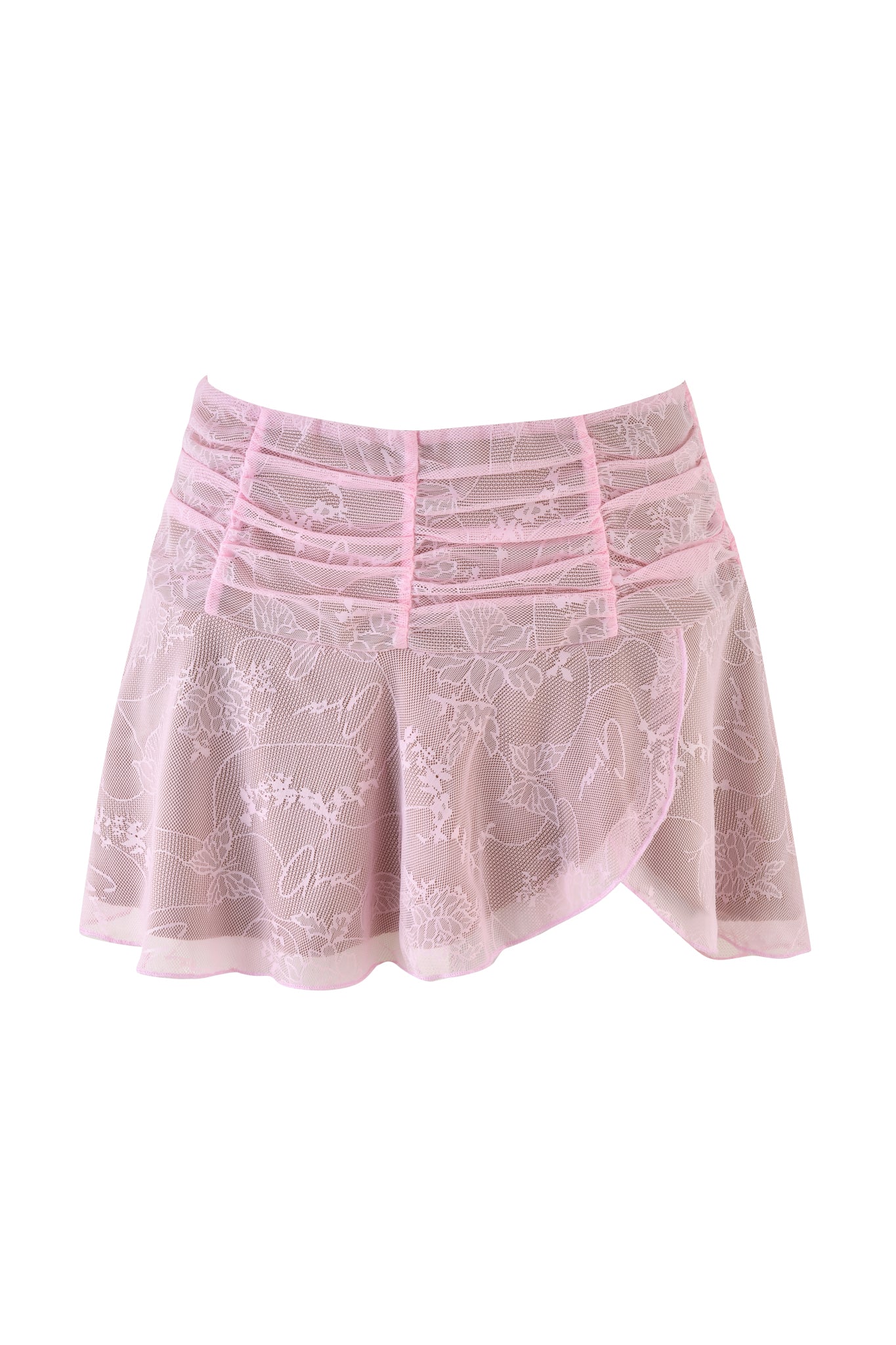 The I.AM.GIA Yvette Skirt in baby pink features a low-rise mini design with a sheer lace overlay adorned in floral patterns. It includes a horizontal ruched waistband and an asymmetric hem, all elegantly presented against a plain white backdrop.