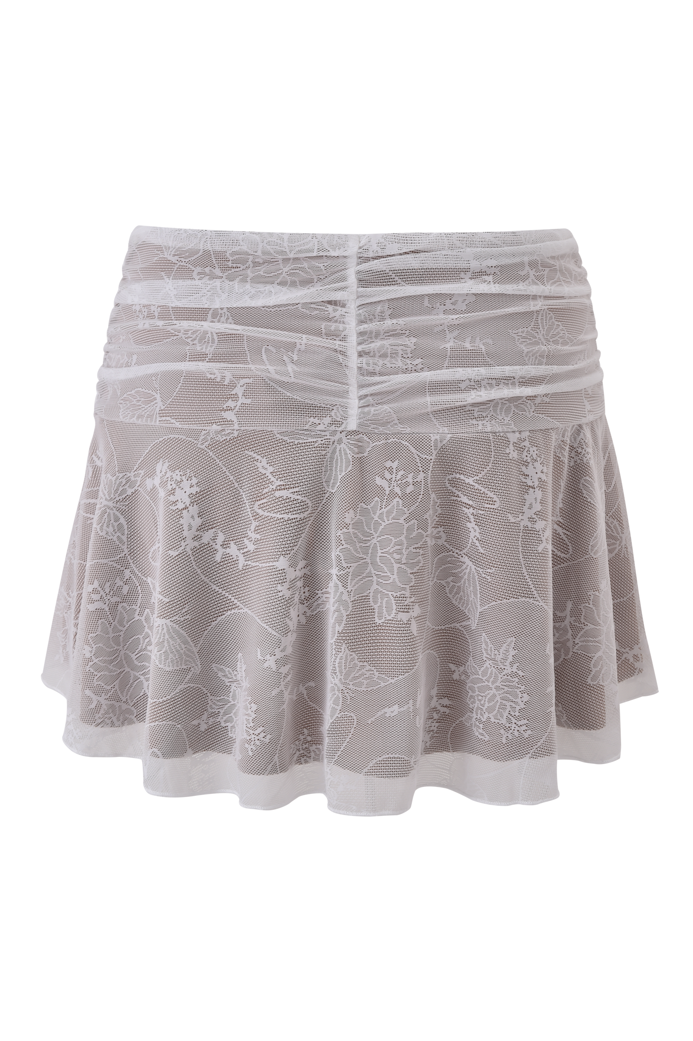The I.AM.GIA YVETTE SKIRT - WHITE: BUTTERFLY LACE is a short, sheer lace skirt with floral patterns, ruched front detailing, and a flared hem. Displayed on a simple light background.