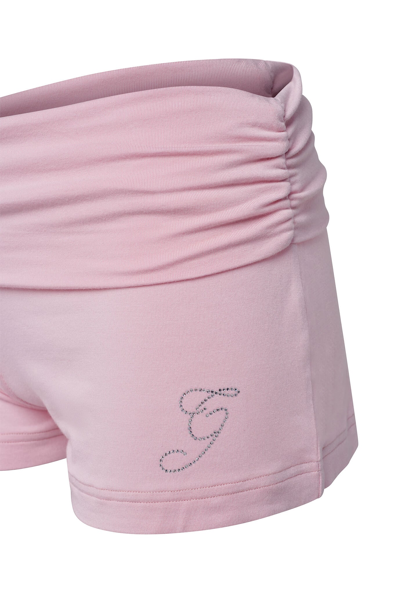 Close-up of the ERIN SHORT - PINK by I.AM.GIA, showcasing a pair of pink bamboo mini shorts with ruched detailing at the waistband. The high stretch fabric appears soft and bodycon fit, featuring an embroidered cursive "G" near the hem of the left leg adorned with small beads or rhinestones.