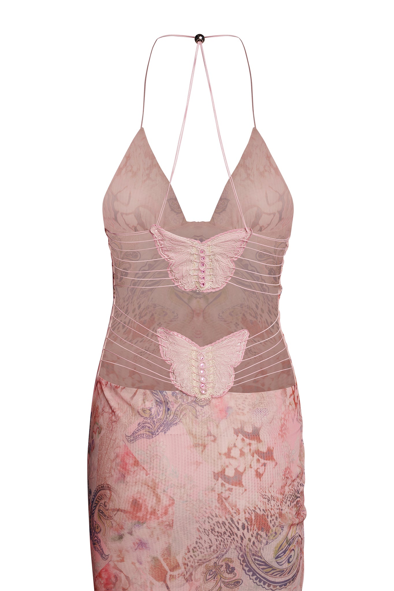 The ELLERY DRESS - PINK : FLORA PAISLEY from I.AM.GIA is a sleeveless, sheer pink dress adorned with intricate butterfly designs on the front. It boasts a fitted bodice with a plunging neckline and delicate straps that tie behind the neck. The lower part of the dress features a captivating floral and paisley pattern in various pastel shades.