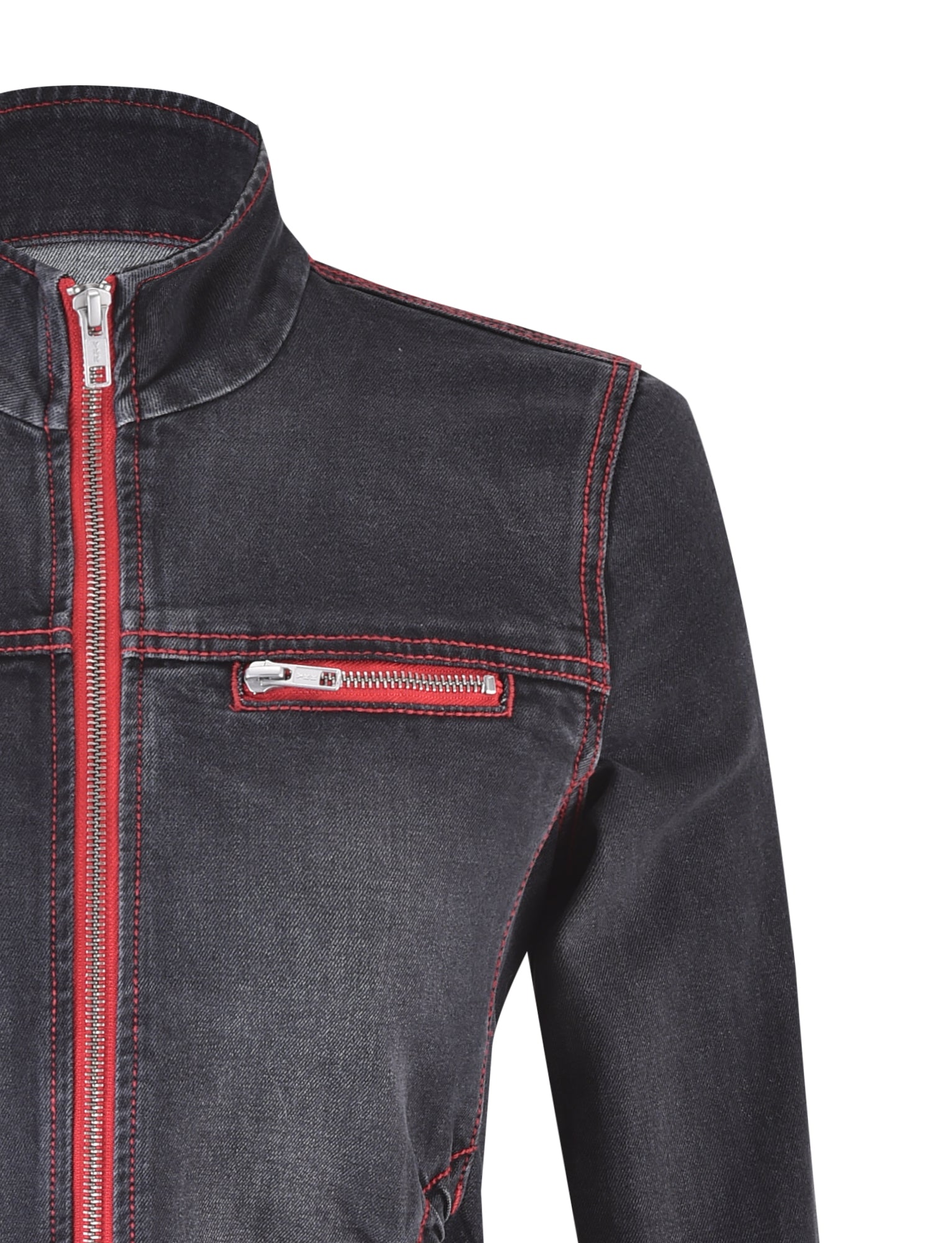 Close-up of the I.AM.GIA NYKKO JACKET - BLACK/RED, showcasing red zipper details and red stitching against dark denim. The jacket features a front zipper and a small zippered pocket on the chest. It has a standing collar, with sleeves not visible in the image. The background is plain white.
