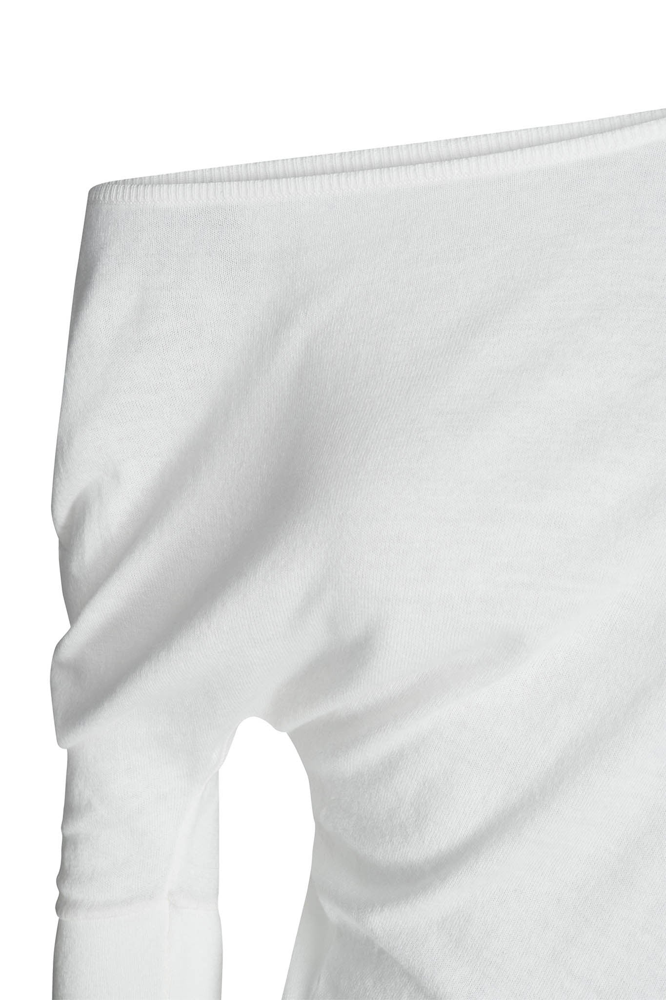 A close-up of the GISELLE TOP - WHITE : CREAM by I.AM.GIA, showcasing a portion of the upper chest area and the left arm. The fabric appears to be soft with a smooth texture, and the top is designed with an asymmetric neckline that sits just above one shoulder.