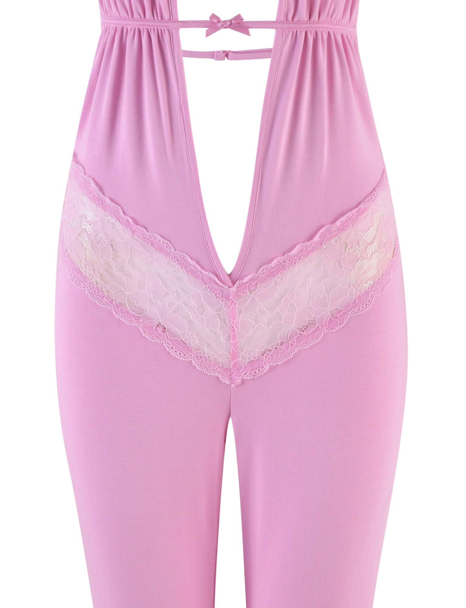 A close-up view of the I.AM.GIA ASTORA JUMPSUIT - PINK, showcasing its deep V-neck cut and delicate lace trim running across the waist area. The material appears to be soft and slightly stretchy, making it ideal for intimate wear or sleepwear.