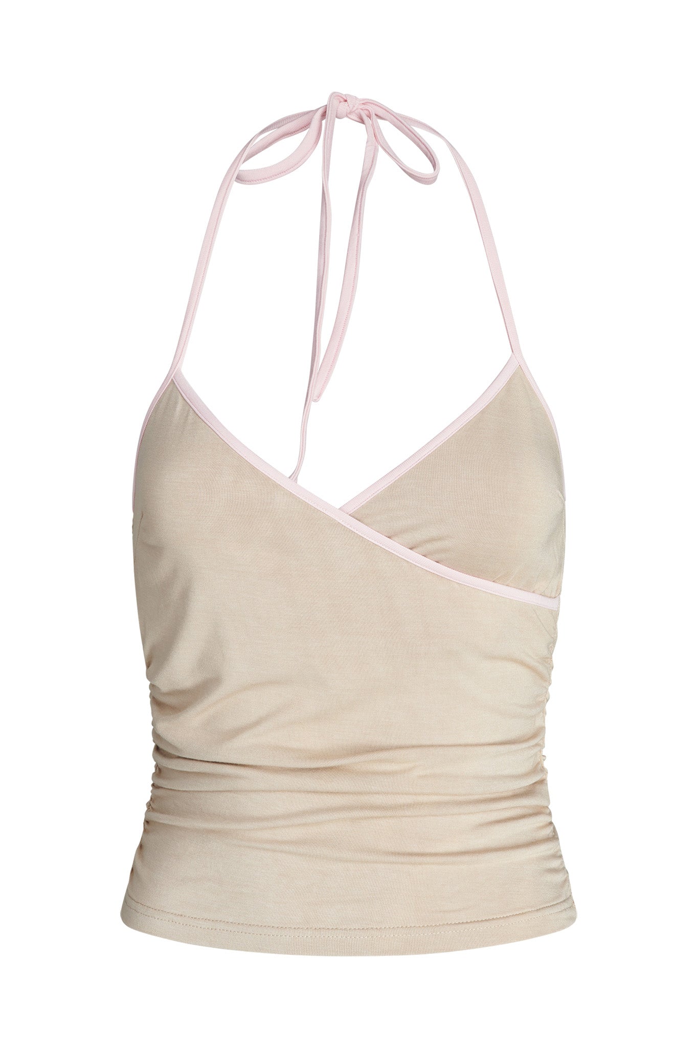 The JANNIS TANK - NEUTRAL : TAN/PINK from I.AM.GIA is a beige halter neck top with a pleated design and thin, light pink straps that tie at the neck. The top features a wrap-style front and a form-fitting shape.
