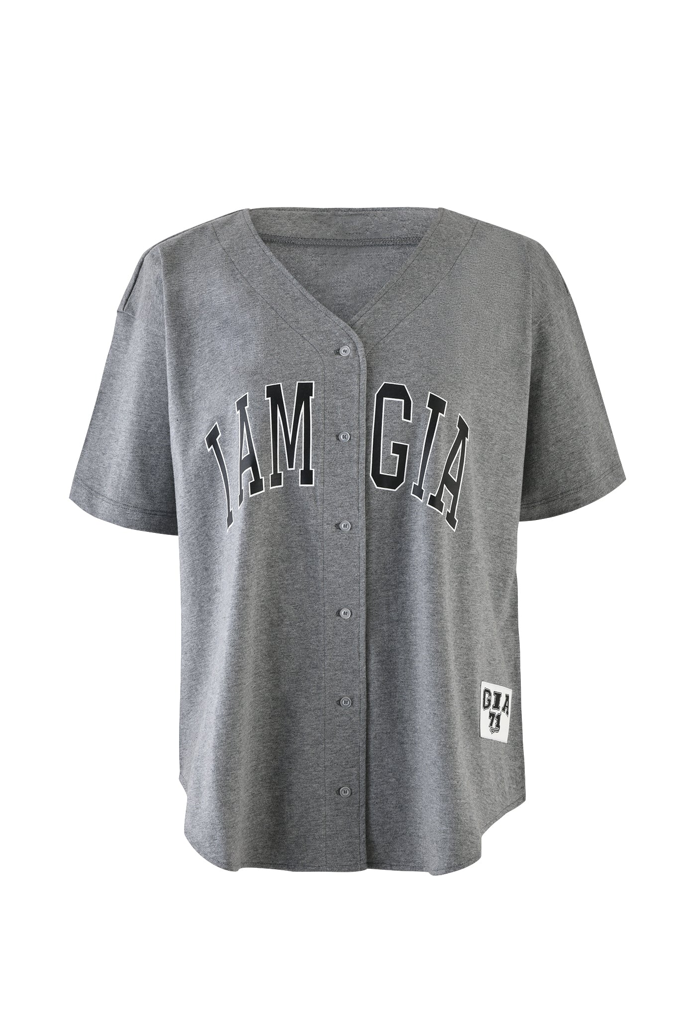 The LORRI JERSEY by I.AM.GIA is a steel grey, short-sleeve, button-up baseball jersey featuring the text "I.AM.GIA" in bold black letters across the chest. A small patch with the logo "GIA 74" is sewn near the bottom hem.