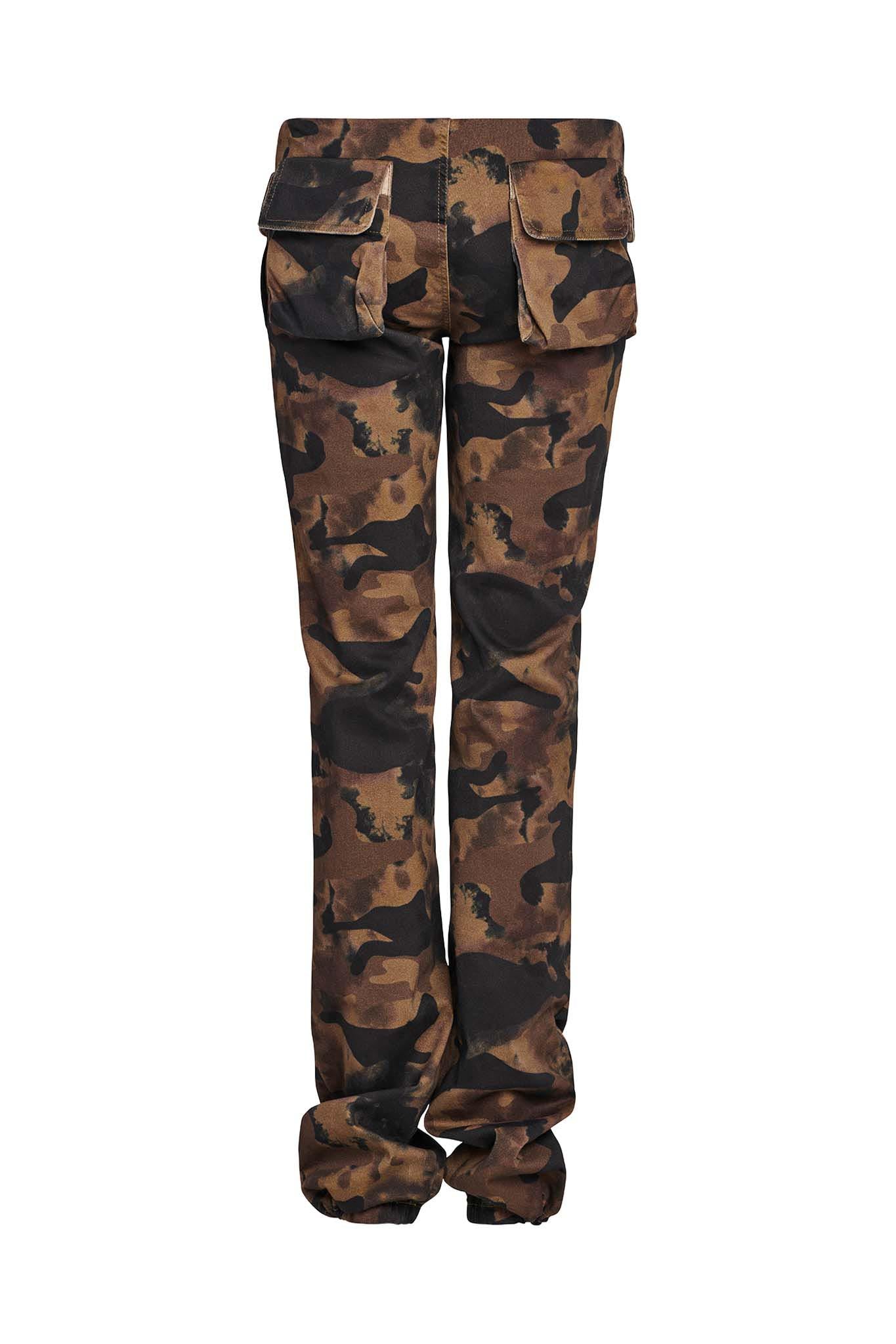Back view of the KIMANI PANT - GREEN : CAMO from I.AM.GIA. The camouflage pattern showcases earthy tones of green, brown, and black. These pants feature two large flap pockets on the upper back and have a slightly baggy fit with gathered hems at the ankles.