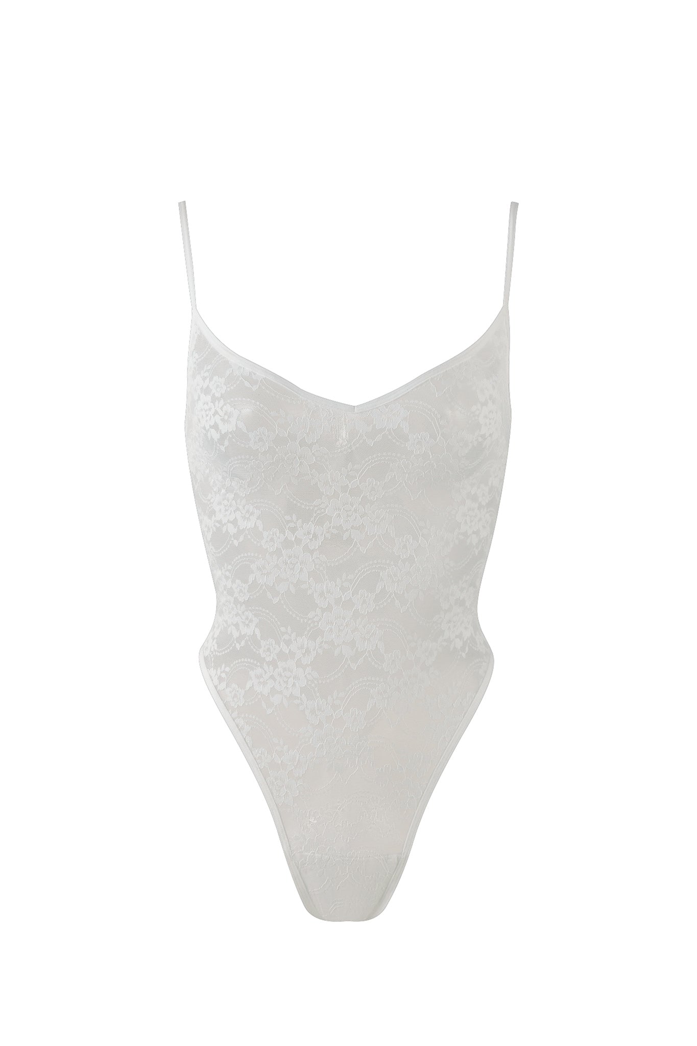 The PERLA BODYSUIT - WHITE from I.AM.GIA is a white, lacy bodysuit with thin spaghetti straps. The fabric is semi-transparent with an intricate floral lace pattern, featuring a high-cut leg design and a V-shaped neckline.