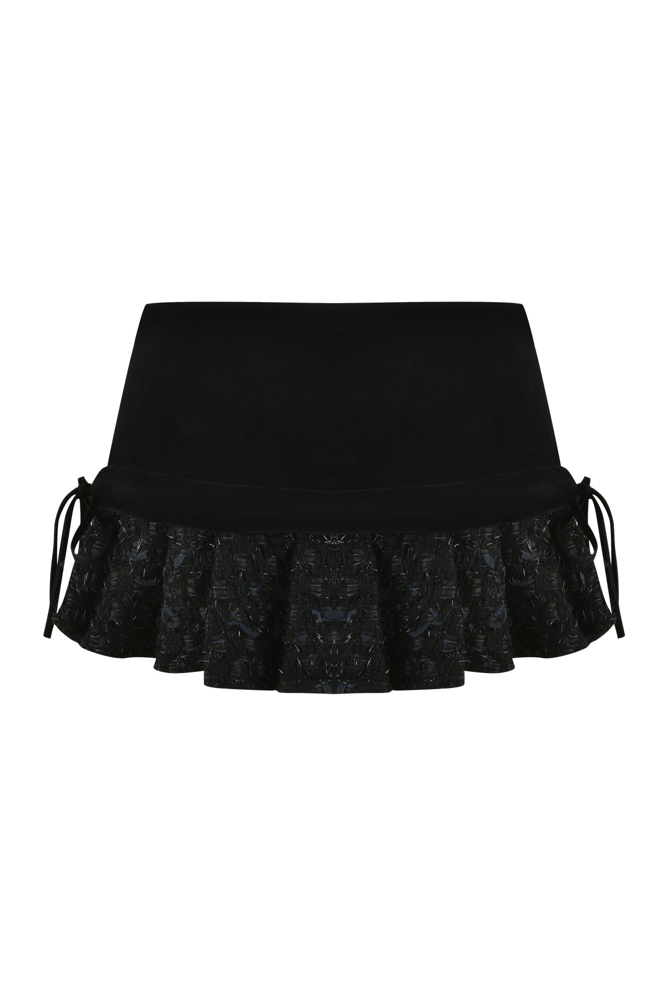 Introducing the SAFFRON SKORT - BLACK by I.AM.GIA: a stylish and elegant piece featuring a flared, ruffled hem with intricate lace detailing and drawstring ties on either side. This low-rise mini skort is designed with a smooth, solid waistband for a chic and sophisticated look.