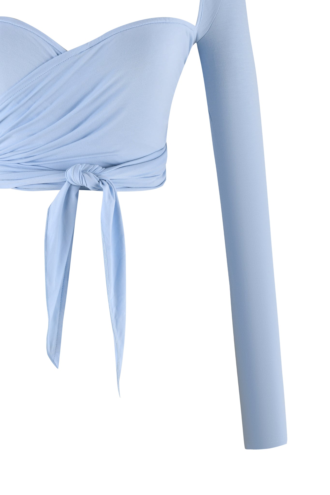 Close-up image of the AMRIA TOP - BLUE : POWDER BLUE from I.AM.GIA. This sky blue wrap top features a bodycon fit with an off-the-shoulder design. It has a central knot with long ties and is crafted from bamboo fabrication, boasting an asymmetrical look with a single long sleeve on one side.