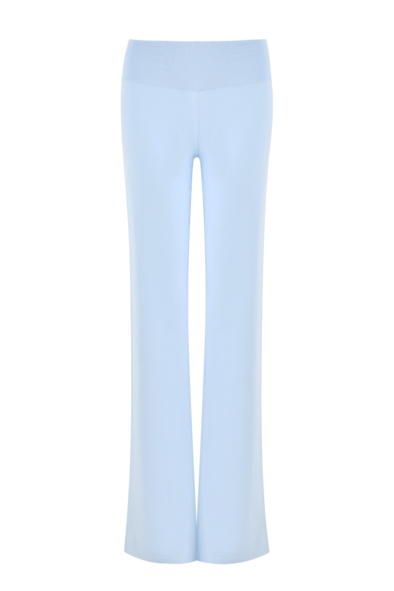The AUDRINA PANT - BLUE in Powder Blue from I.AM.GIA is laid flat against a plain white background. These pants feature a tall rib waistband with a slightly high-waisted design, offering a smooth, seamless fit that flows loosely through the legs.