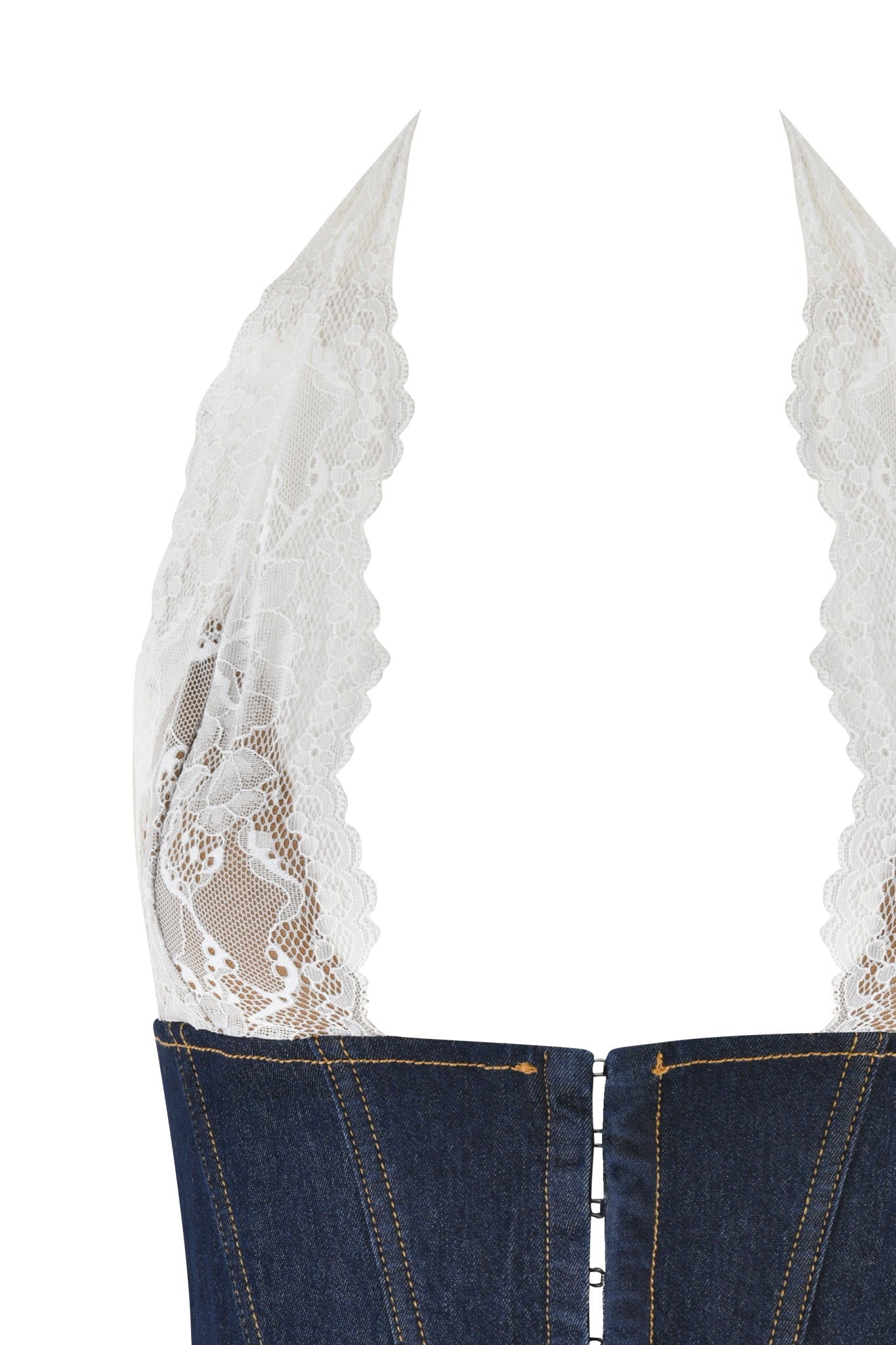 Get a close-up of the ELLENA CORSET - BLUE : DARK WASH by I.AM.GIA. This denim dress features white lace halter straps and top edge trim. The form-fitting bodycon fit contrasts beautifully with the delicate white lace, while visible stitching and a front hook closure complete the look.