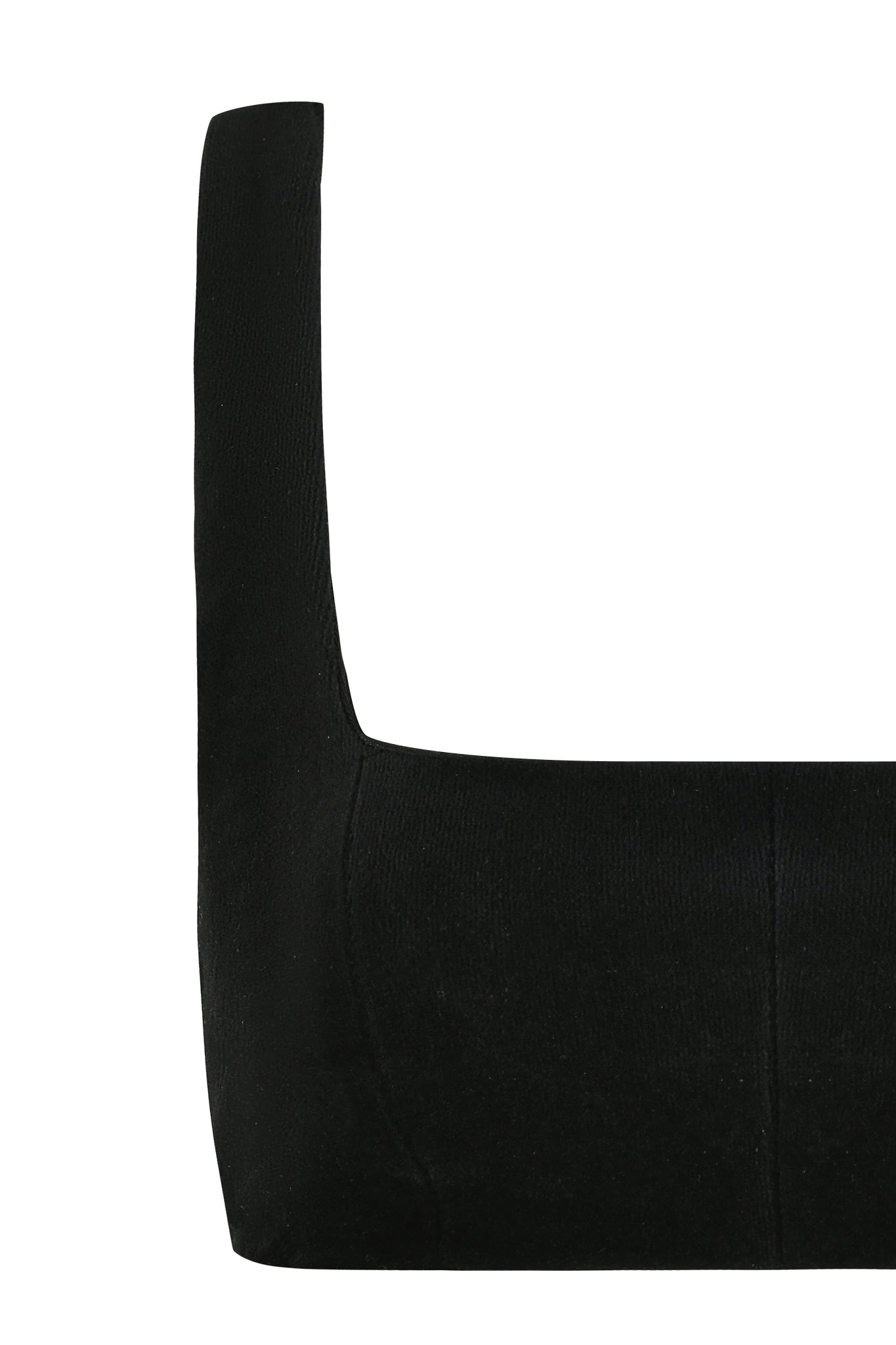 Close-up of the LAURA CROP TOP - BLACK by I.AM.GIA against a white background. The stretchy, form-fitting fabric resembles velour fabrication, exuding clean lines and a minimalist design. Only the upper part of this chic bodycon top is visible in the image.