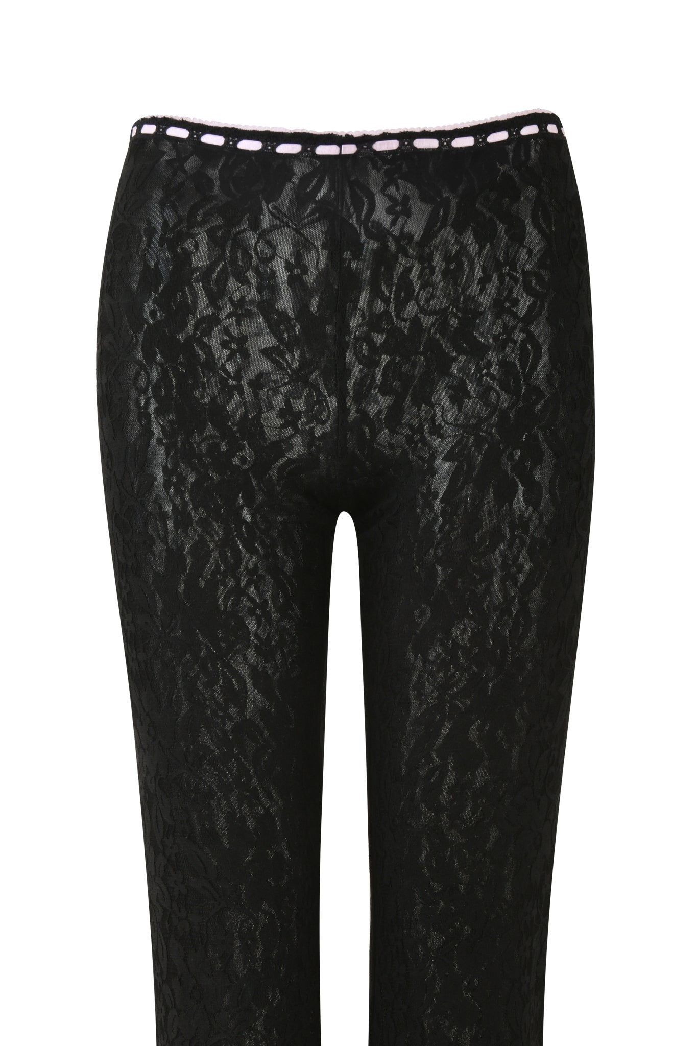 The LORAH PANT - BLACK by I.AM.GIA is showcased from the back, featuring intricate floral patterns with a white threaded detail at the waistband. Their pull-on construction ensures a snug fit through the hips, while the shiny material reflects light to emphasize texture.