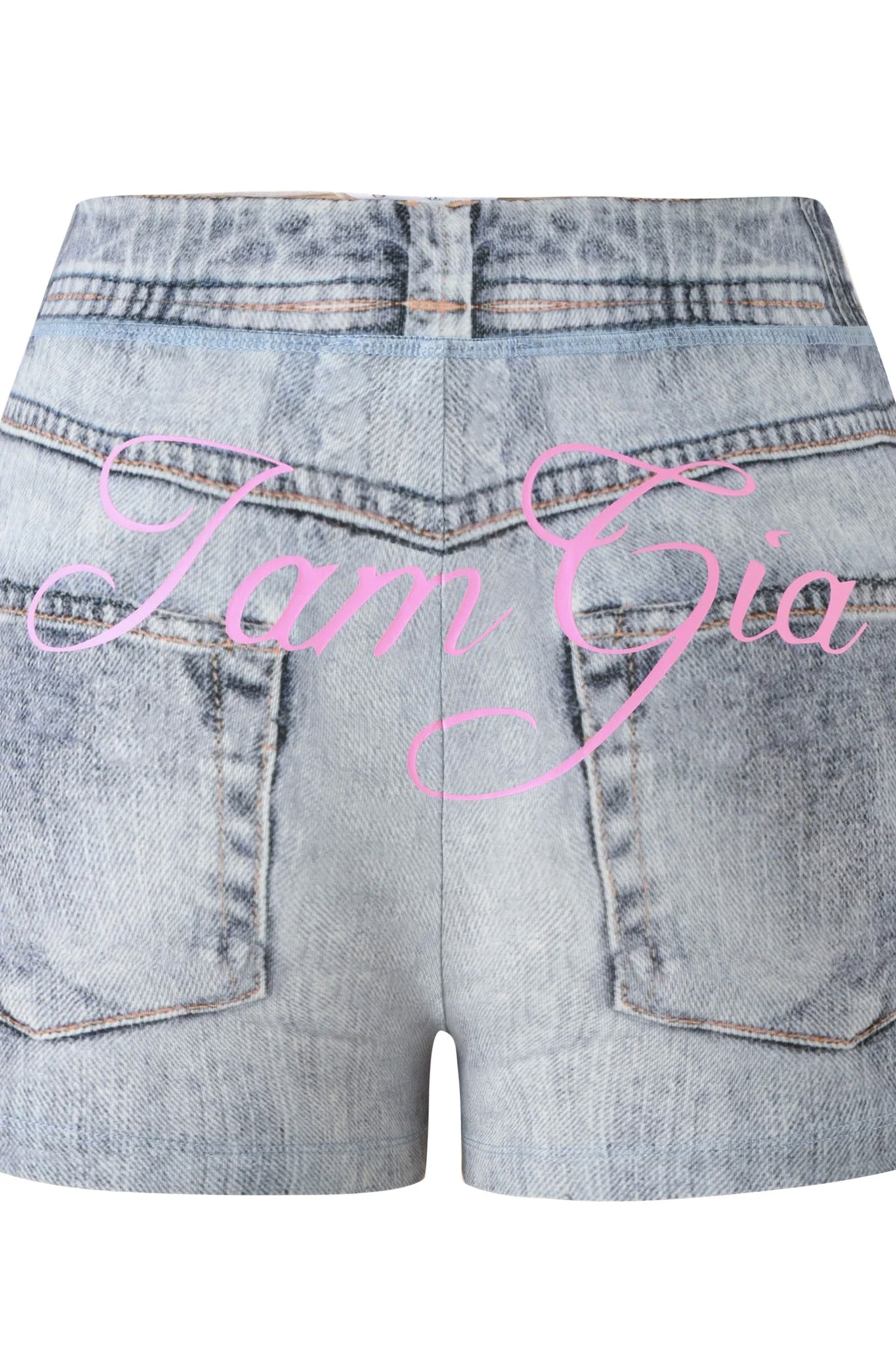 The BLARE SHORT - DENIM TROMPE L’OEIL by I.AM.GIA are high-waisted light blue denim shorts with back pockets, featuring “IamGia” written in pink script across them.