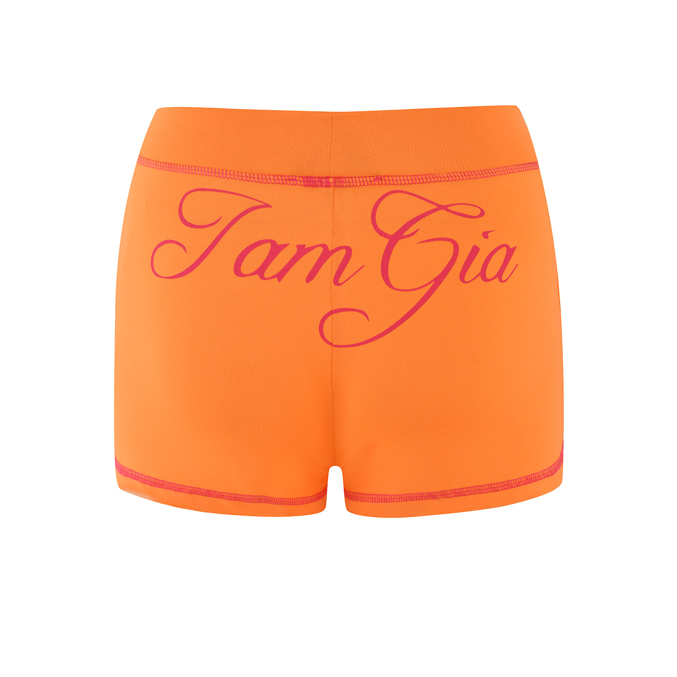 I.AM.GIA's BLARE SHORT - ORANGE features pink trim and "Tam Gia" in cursive on the back, offering a vibrant style. Crafted from bamboo, these shorts provide a soft feel and comfy fit, ideal for casual outings.