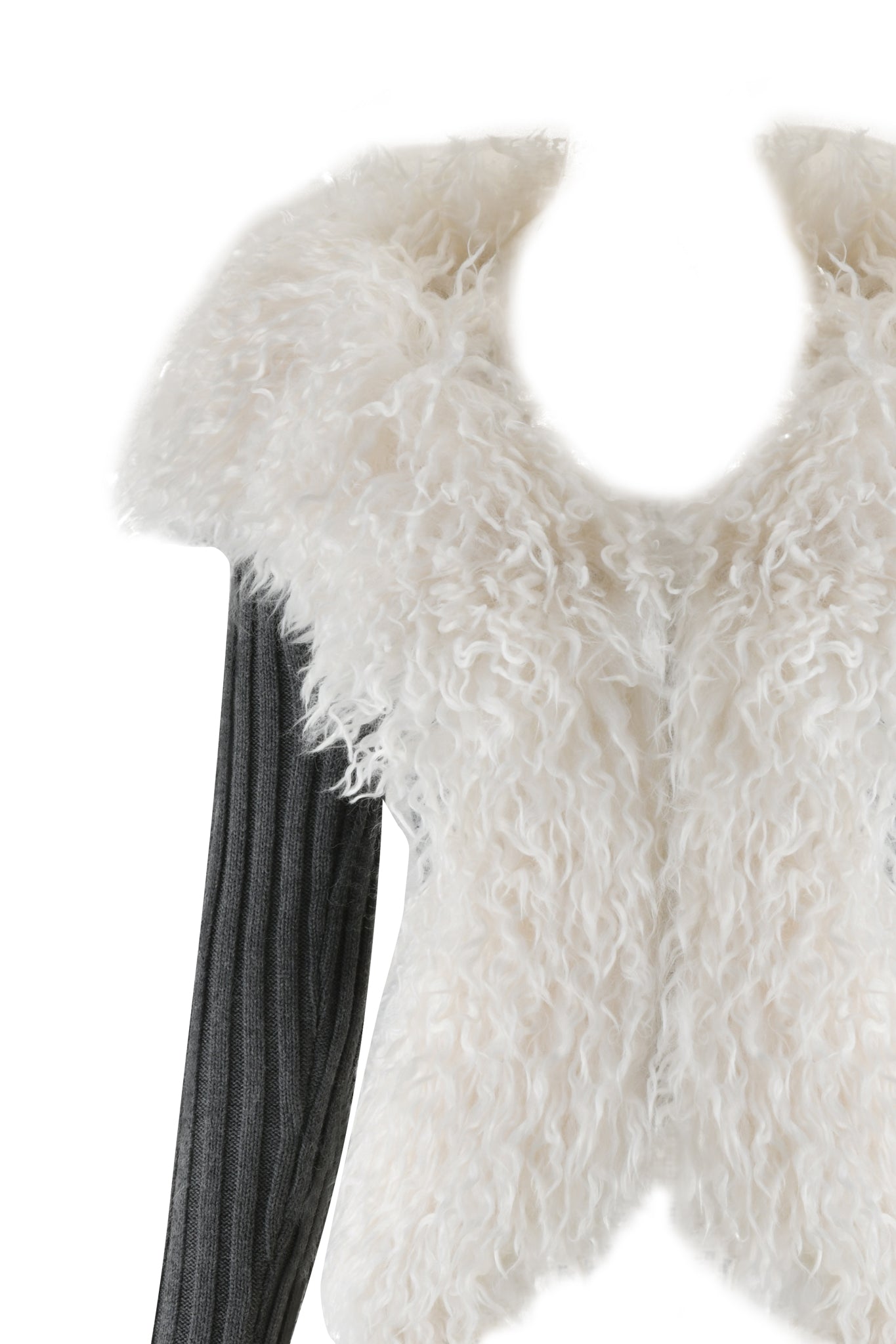 The CRESSIDA JACKET - GREY by I.AM.GIA is showcased on an invisible mannequin. It features a fluffy faux fur design with a large collar and exposed zipper, layered over a dark, ribbed long-sleeve top for a cozy and textured look.