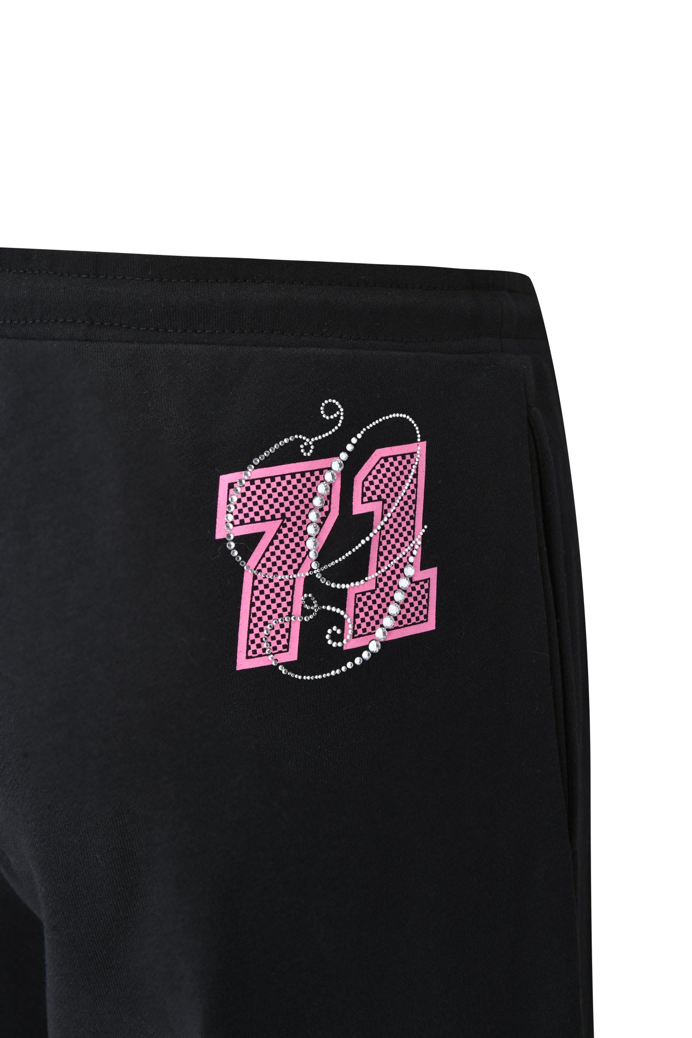 Close-up of the I.AM.GIA ARLO TRACK PANT - BLACK, a low rise pant with a pink and white "71" plus decorative swirls and dots on the upper thigh.