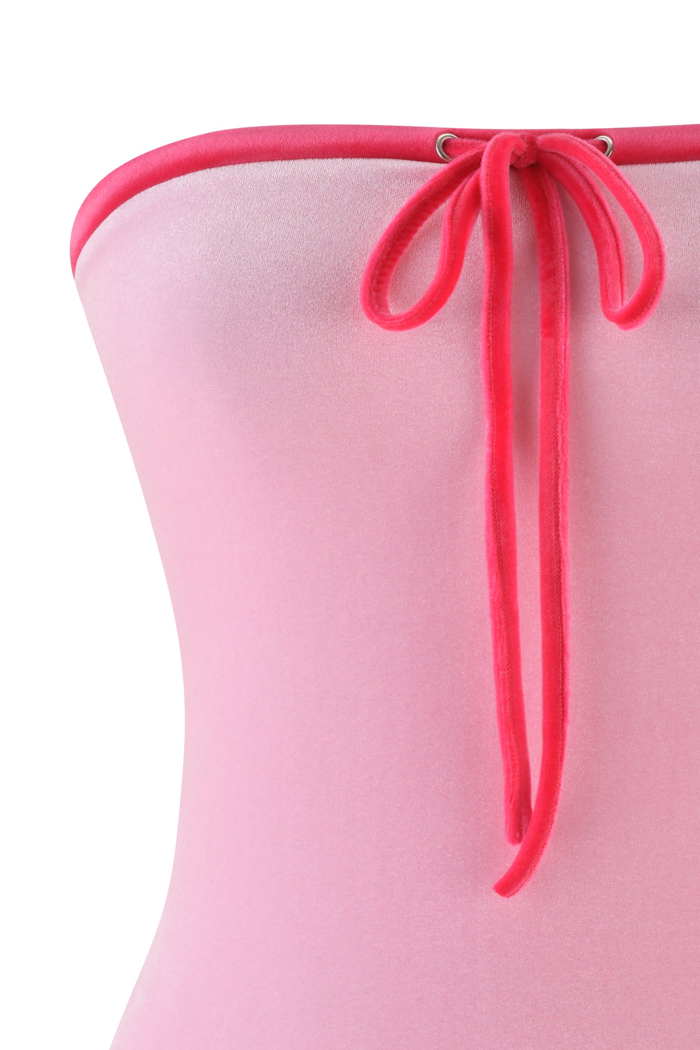 Close-up of a baby pink, off-the-shoulder MICHELLE VELOUR BOOB TUBE from I.AM.GIA, featuring a bright pink trim and central tied bow, smooth and snug against a white backdrop.