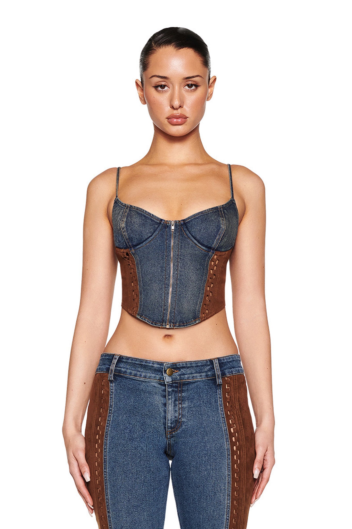 Someone wearing the FORREST BUSTIER - BLUE: MEDIUM WASH by I.AM.GIA, paired with matching denim pants featuring suede contrast panels, against a plain white background.