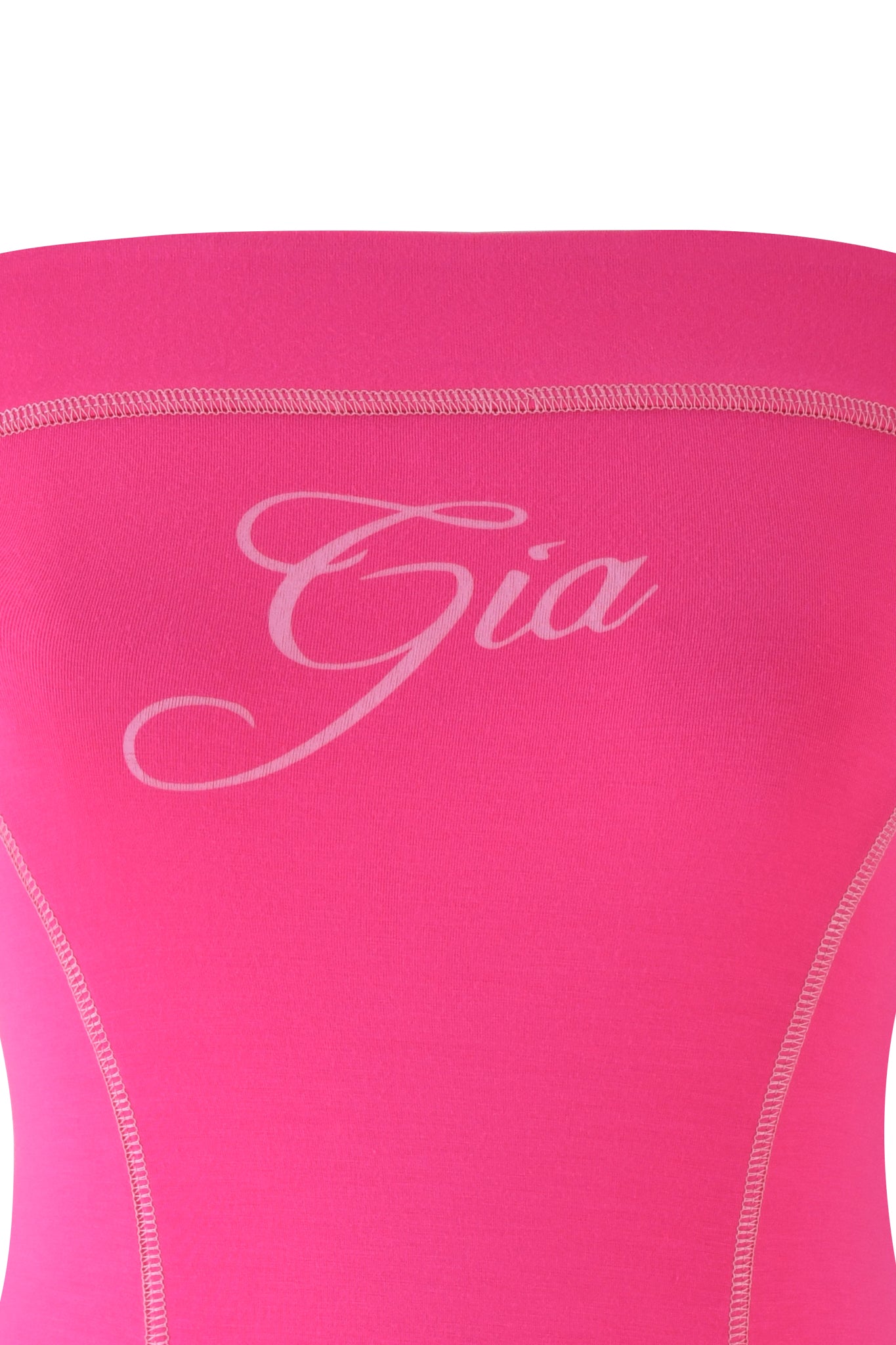 A close-up of the BLARE TUBE MINI DRESS in hot pink by I.AM.GIA features a sleek bodycon fit with "Gia" elegantly scripted across the chest and visible seam lines on the sides.