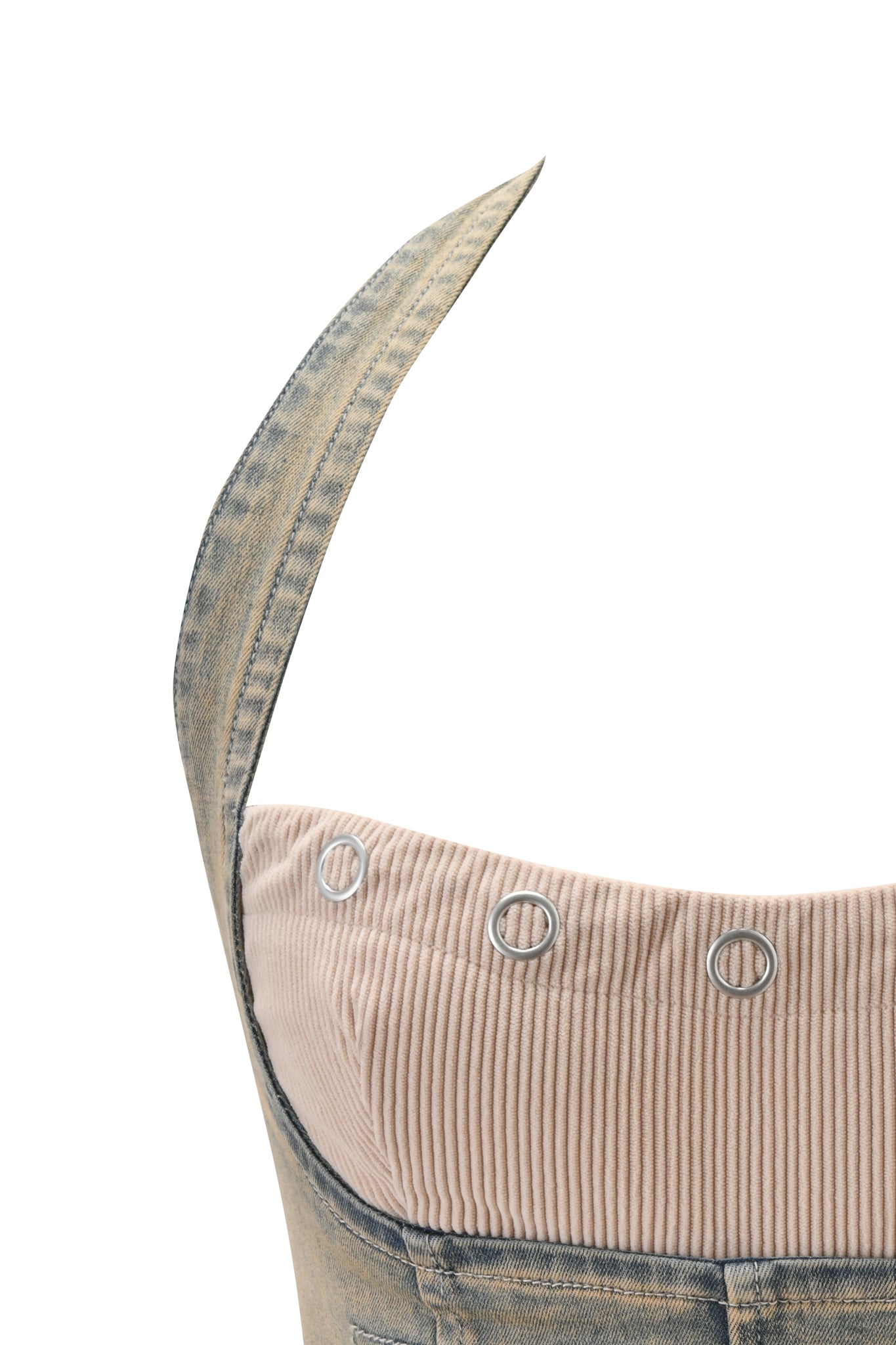 Close-up of the I.AM.GIA TOMMIE CORSET - ANTIQUE DENIM, a sleeveless denim corset dress with a beige corduroy top and metal eyelets, shown on a white background.