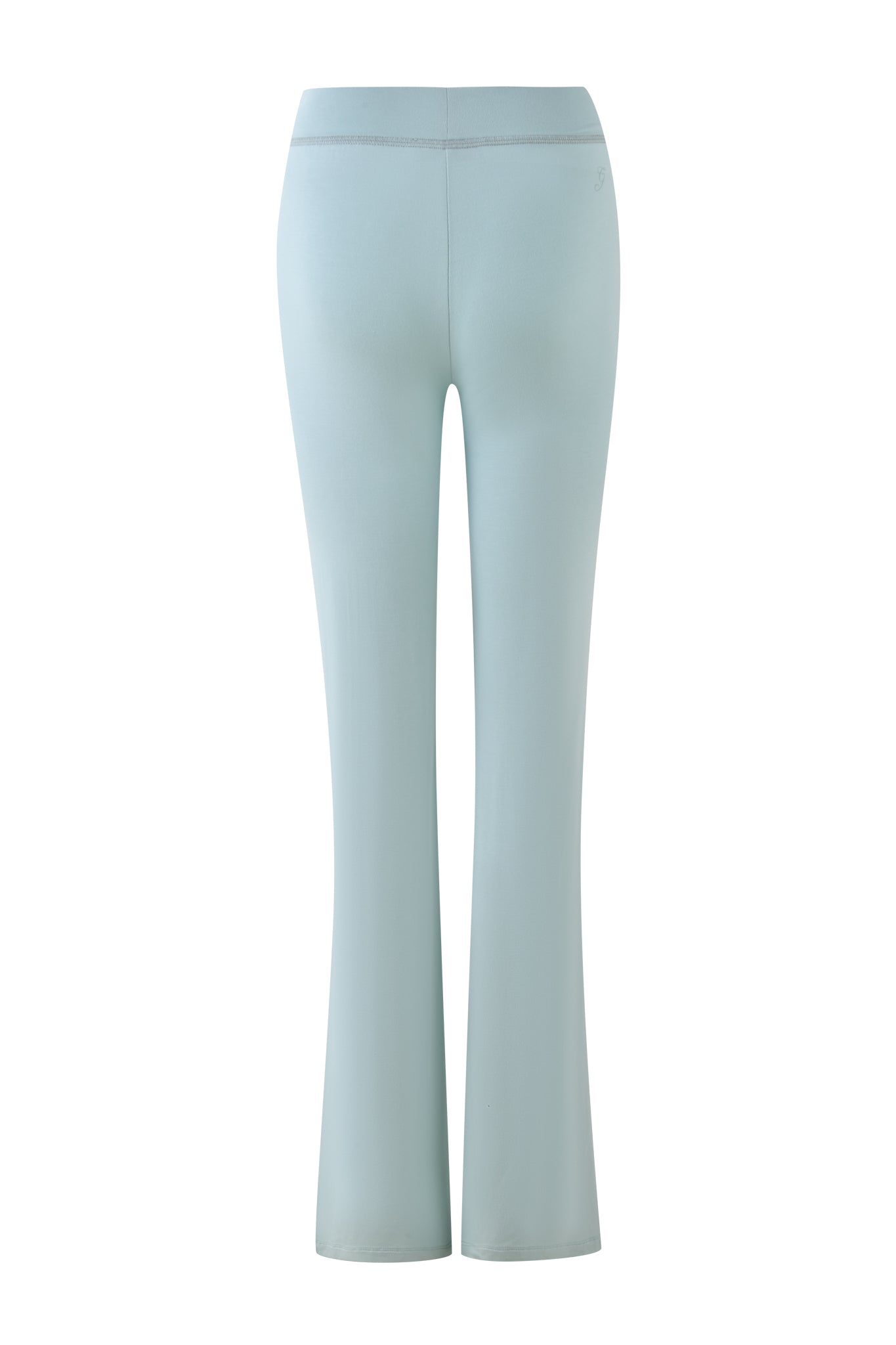 Rear view of seafoam yoga pants against a white background. Crafted from bamboo and jersey, the BLARE TRACKPANT by I.AM.GIA is form-fitting with a high waist and slightly flared legs.