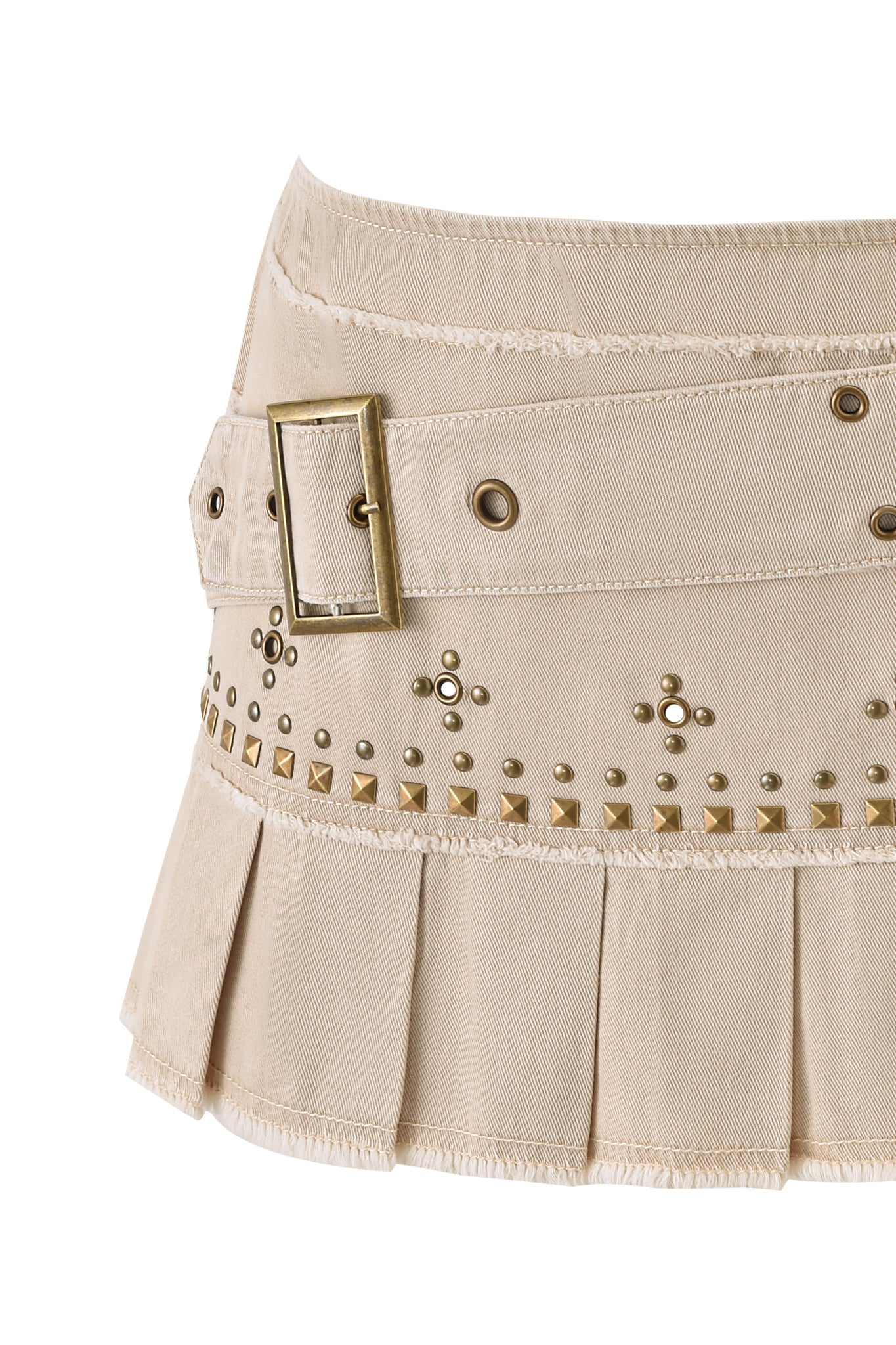 The MASON MINI SKIRT - TAN by I.AM.GIA is a tan canvas pleated mini skirt with a wide waistband, large gold buckle, gold studs, and grommet detailing for extra flair.