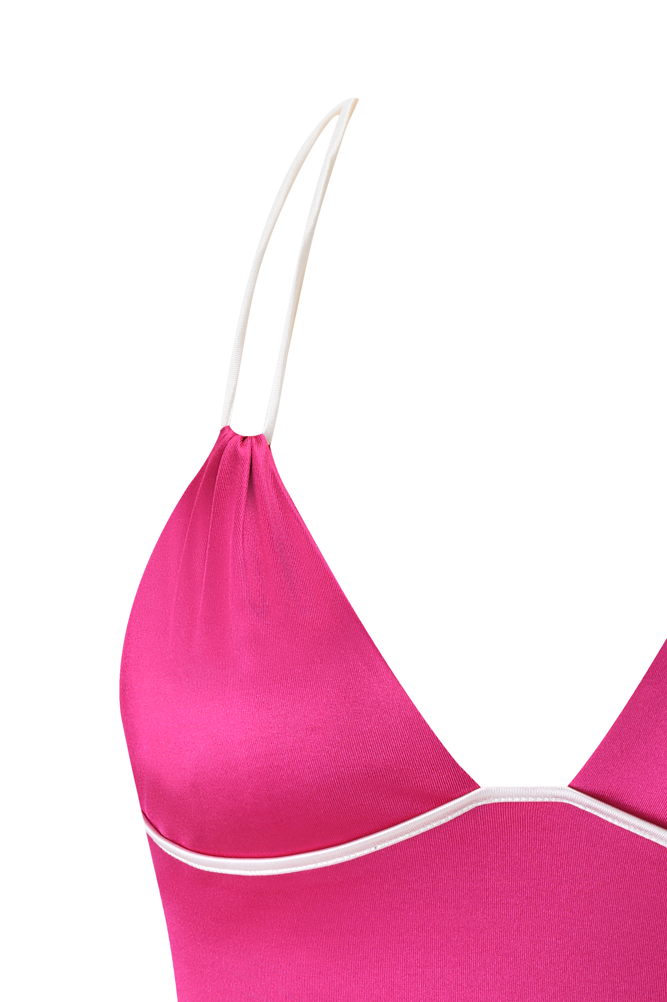 Close-up of the CHERRY TOP - DARK MAGENTA by I.AM.GIA, a pink camisole with white trim and thin straps, showcasing a body-hugging fit against a white and pink background.