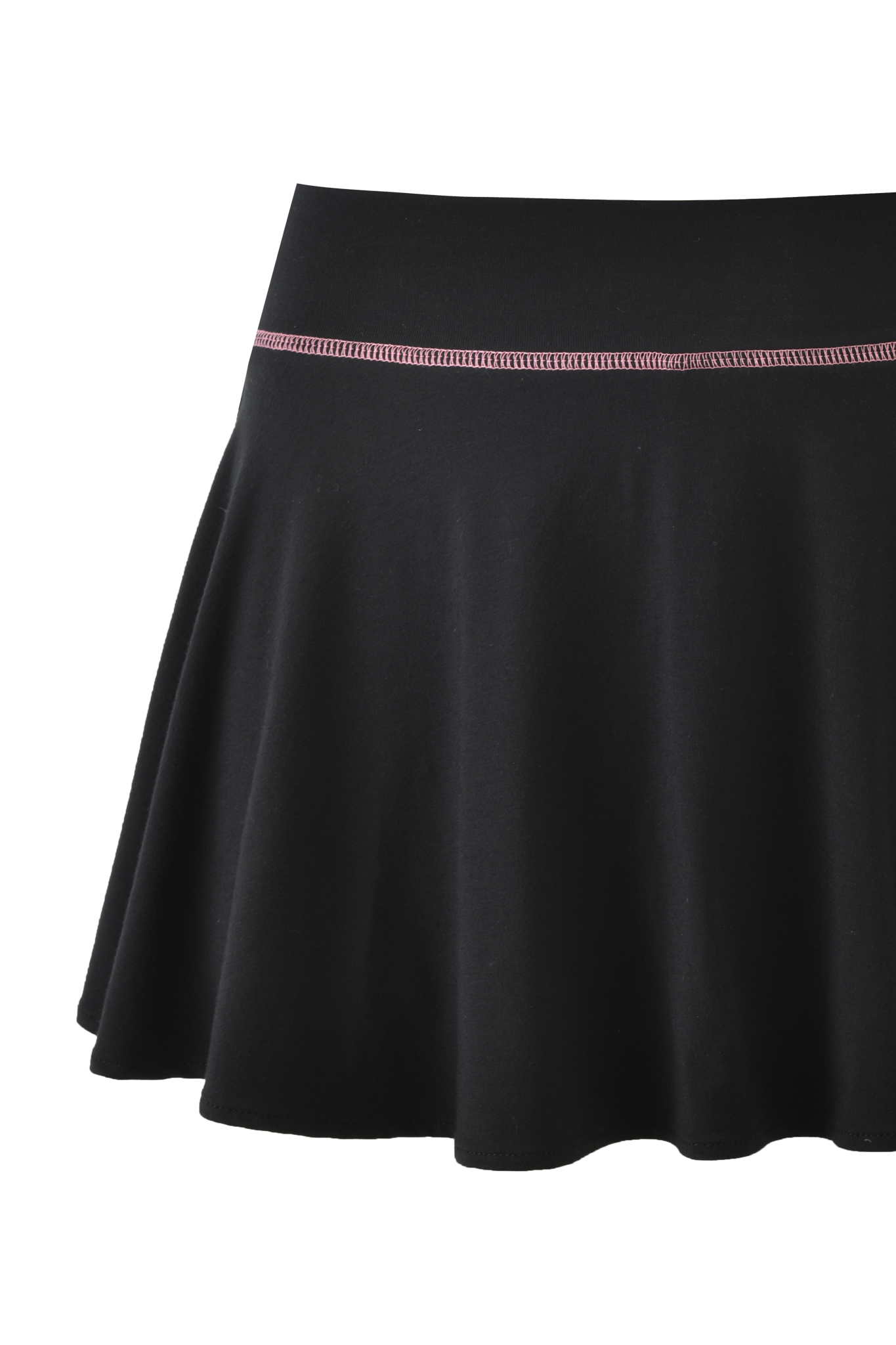 The BLARE SKORT - BLACK by I.AM.GIA features an A-line silhouette, fitted waistband, and subtle pink stitching near the top, combining a skater skirt style with modern details.