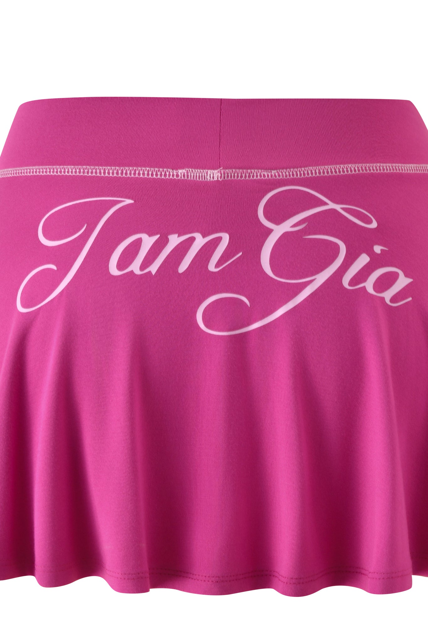 The BLARE SKORT - RASPBERRY by I.AM.GIA is an A-line skort in raspberry with white cursive "I.AM.GIA" text on the waistband.