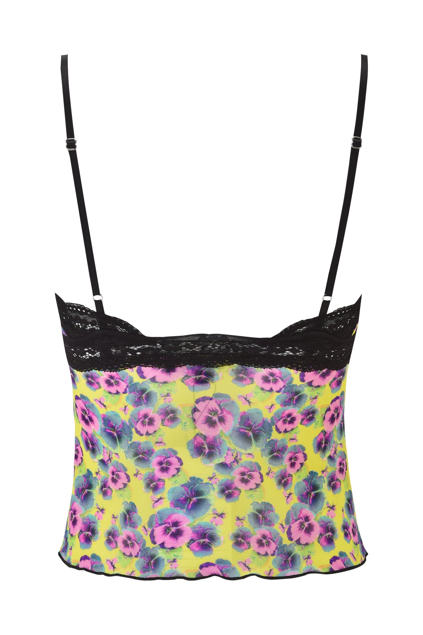 The image shows the stylish back of the I.AM.GIA GRACIE LACE CAMI - SASSY PANSY, a women's mesh cami with black adjustable straps, lace trim on top, and vibrant yellow fabric featuring a neon purple and blue floral print.
