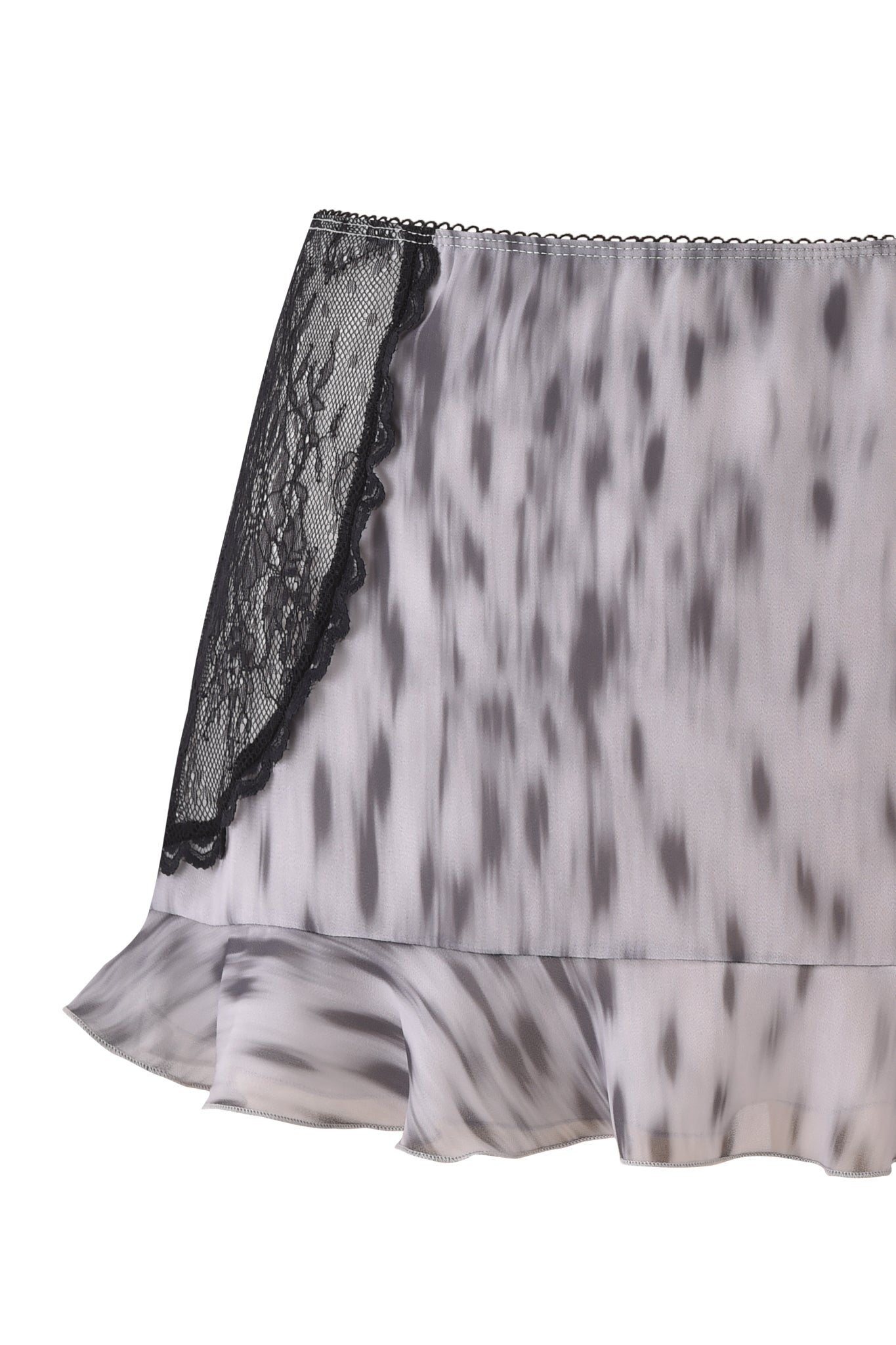 The COLETTE LACE PANEL MINI SKIRT by I.AM.GIA is a silky, low-rise mini skirt with white and gray spotted fabric, a ruffled hem, and black lace panel trim on the side.