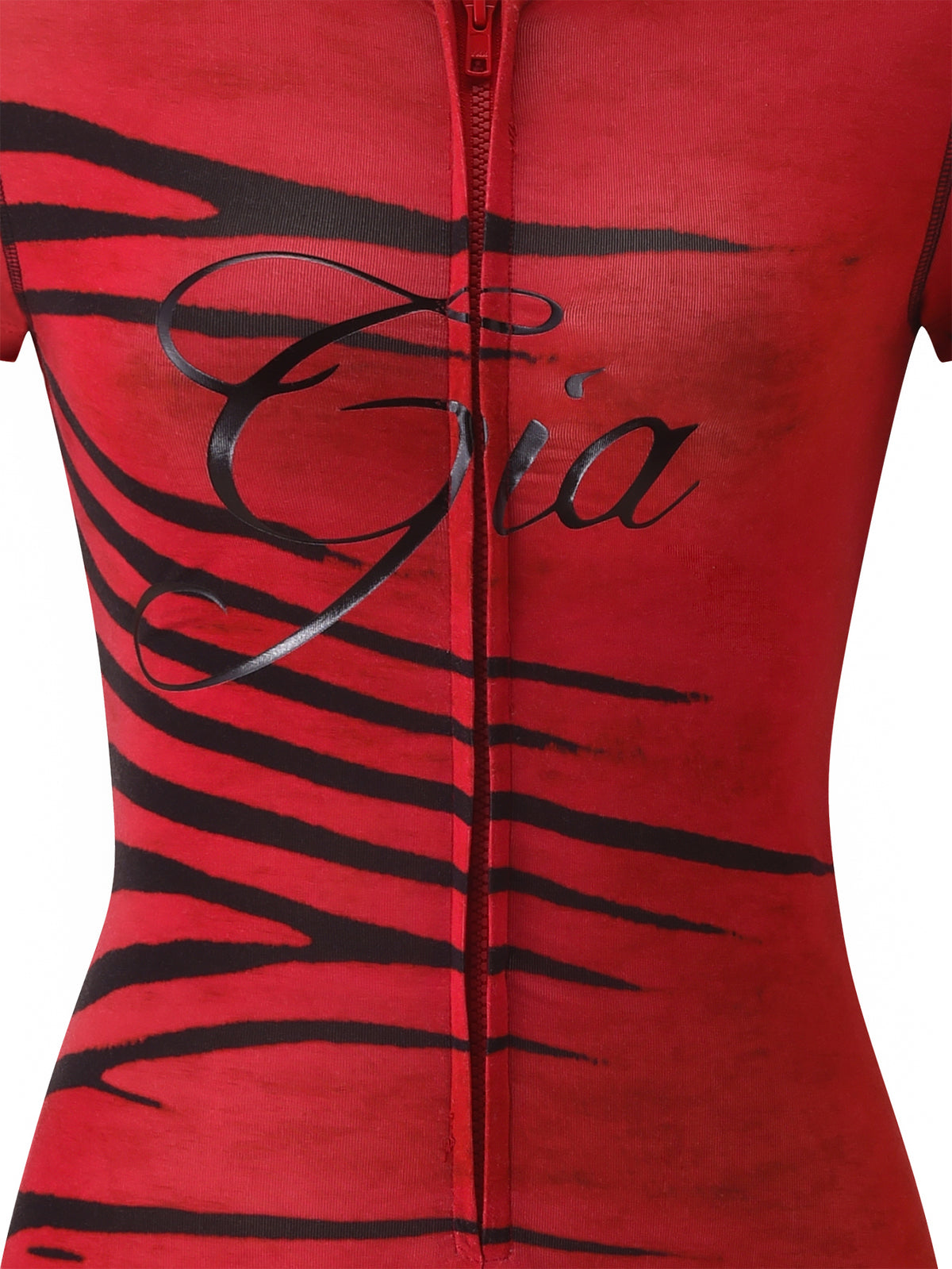 The BLARE SHORT SLEEVE ROMPER - RED WILD SIDE by I.AM.GIA features a bold red zebra print in a close-fitting bodycon mini romper silhouette, finished with red and black stripes, a visible zipper, and “Gia” written in black script on the chest.