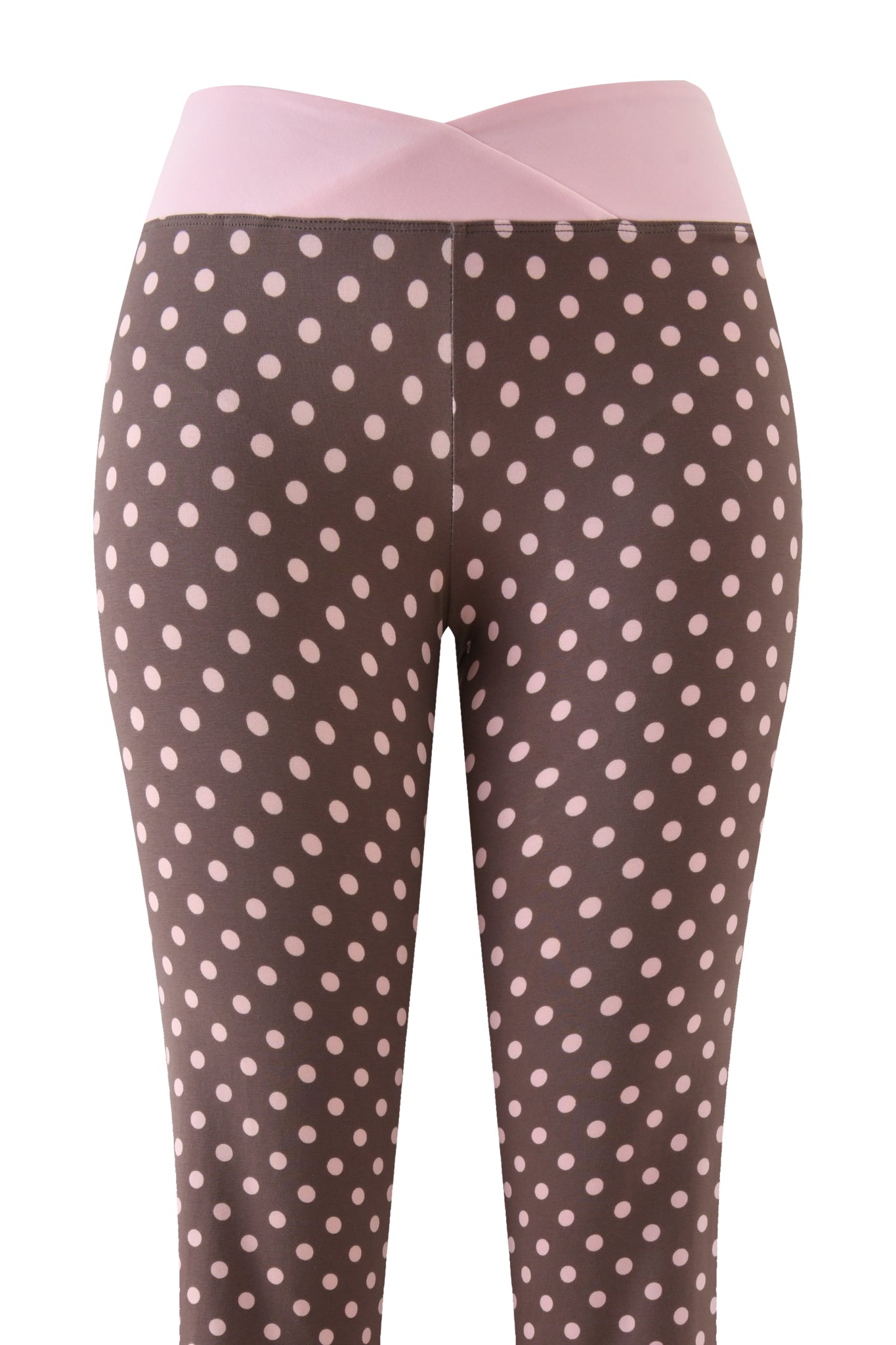I.AM.GIA’s BLARE CROSSOVER PANT - PINK CHOCOLATE features brown polka dot print with light pink dots, a light pink crisscross waistband, and a stylish flared leg inspired by the original Blare crossover pant. Front view shown.