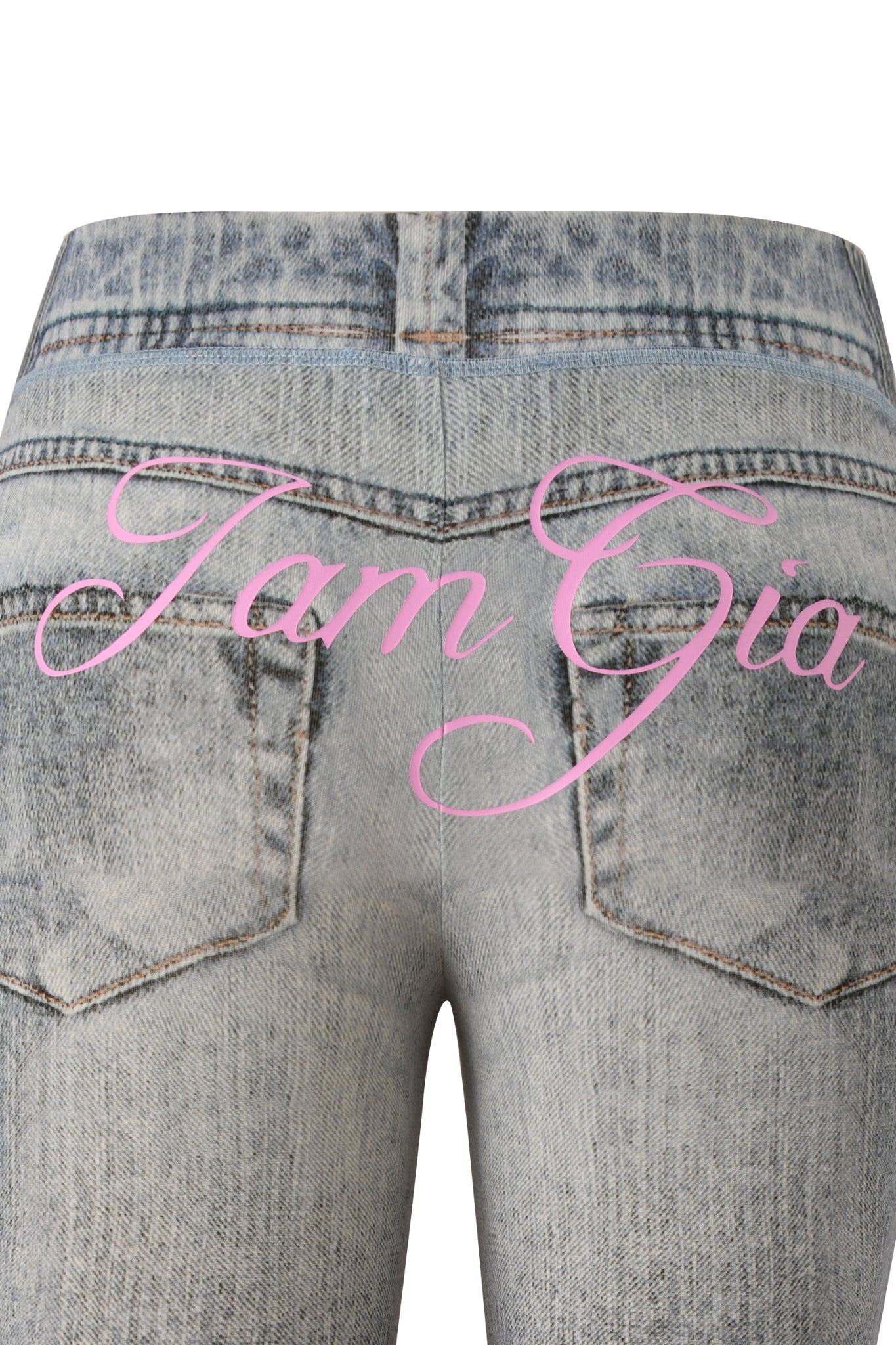 Close-up of the back of I.AM.GIA’s BLARE CAPRI - DENIM TROMPE L’OEIL jeans in light blue, featuring two pockets and “Tam Gia” in pink script, inspired by a faux-denim look and the signature Blare capri pant.