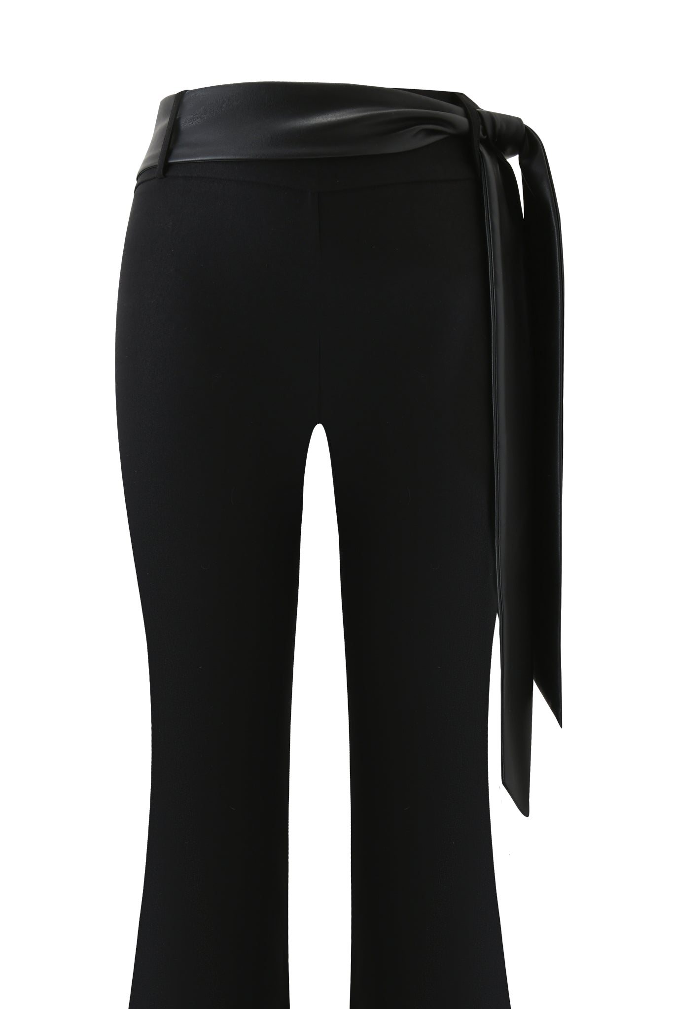The FELIZ PANT - BLACK by I.AM.GIA features black flare legs, a wide high-rise waistband, and a long faux leather belt knotted on the left. Shown from the back against a white background.