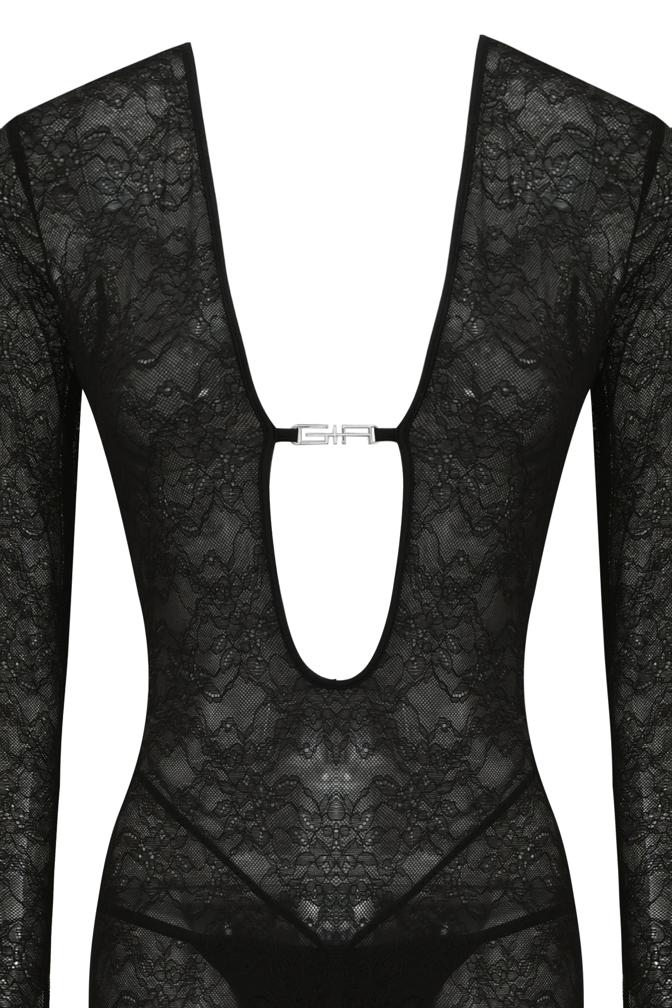 The TIGRA CATSUIT - BLACK by I.AM.GIA is a black long sleeve lace bodysuit with a bodycon fit, deep V-cut neckline, and metallic clasp. The semi-sheer floral lace adds an elegant touch.