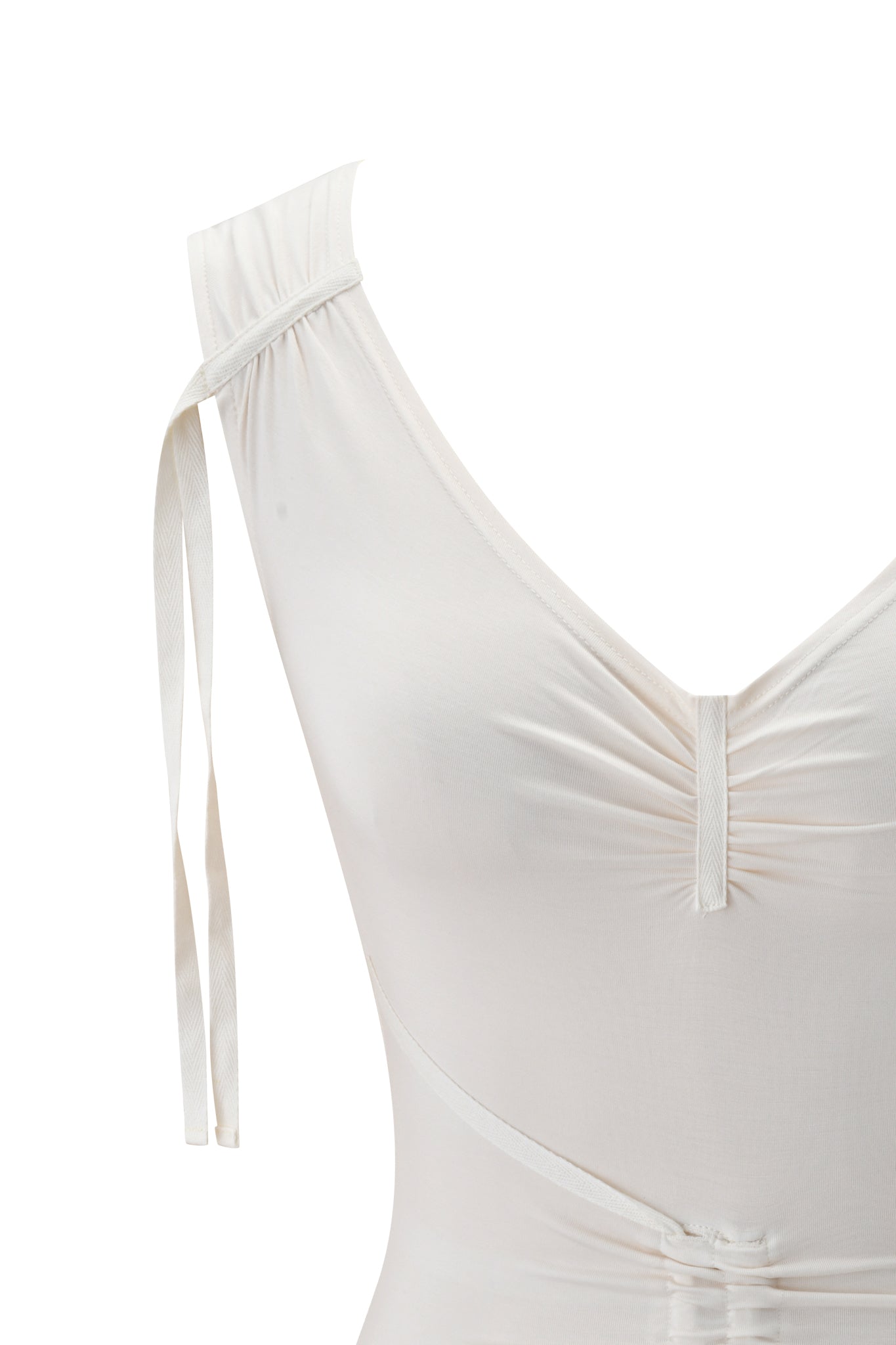 Close-up of the ASHA TOP - CREAM by I.AM.GIA, a white, sleeveless top in a cream shade with a V-neckline, ruched bust detail, and a tied ribbon on one shoulder. The soft, slightly stretchy fabric blends with the white background.