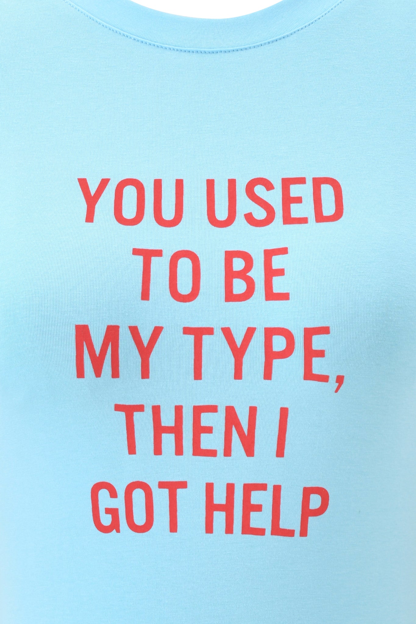 The POLINA TEE - TYPE by I.AM.GIA is a light blue graphic t-shirt featuring bold red text that says, "YOU USED TO BE MY TYPE, THEN I GOT HELP.