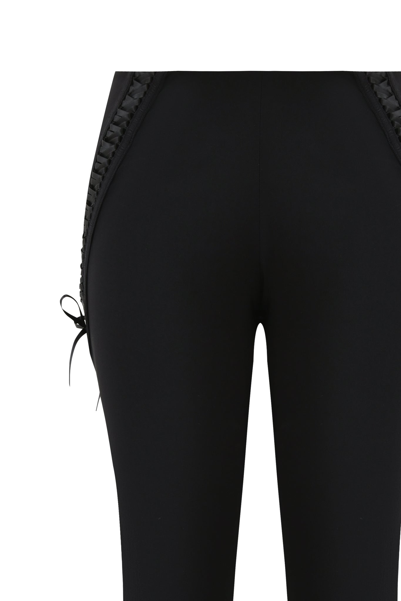 Close-up of the I.AM.GIA SAMIRA PANT in black, showcasing braided trim along side seams, a small left-side bow tie, and subtle lace-up details, photographed against a white background.