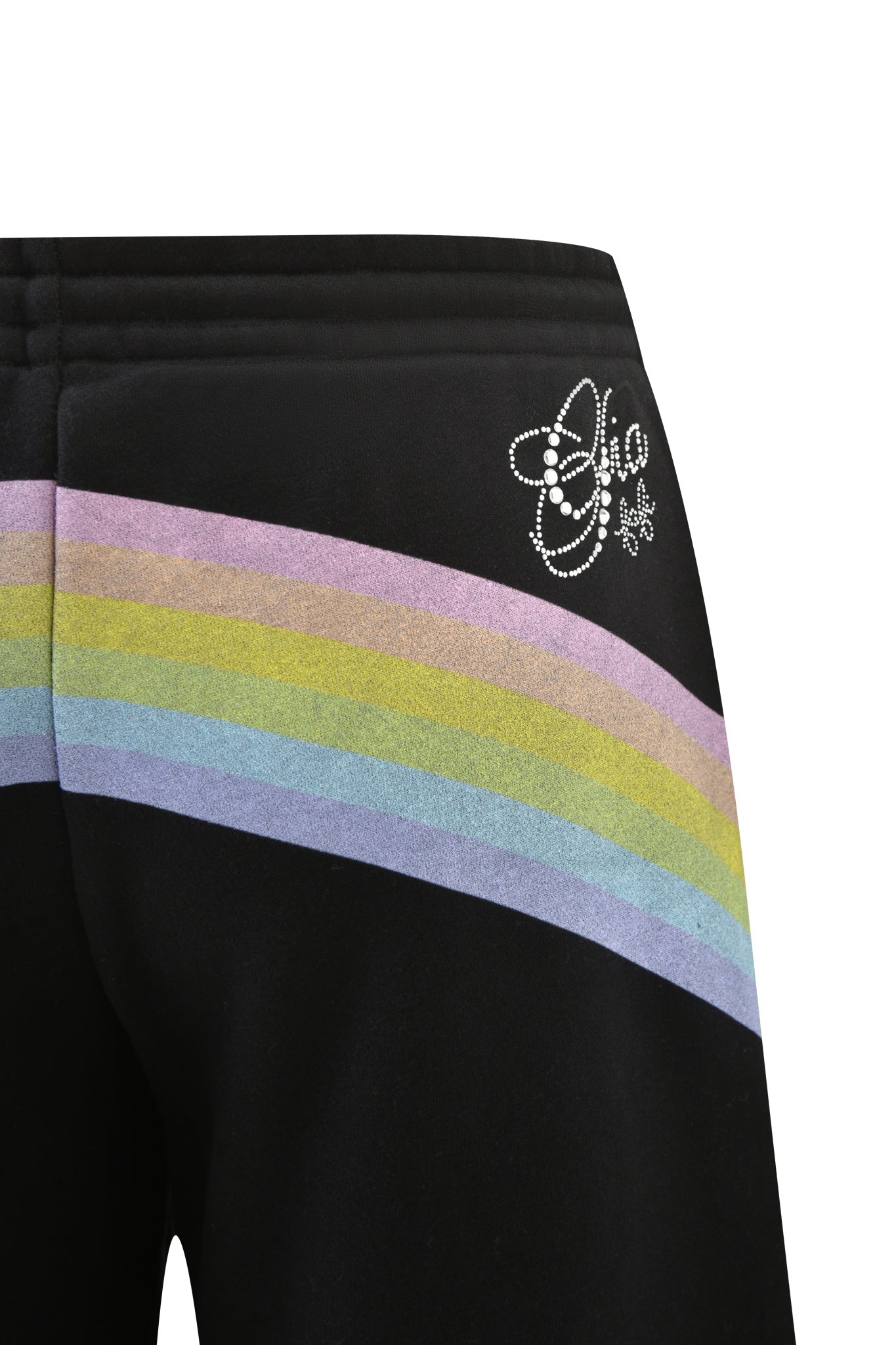 Close-up of I.AM.GIA FAFI TRACKPANT - BLACK, showcasing pastel rainbow stripes across the hip and a metallic silver logo with star and heart details near the waistband on these vibrant, baggy track pants.