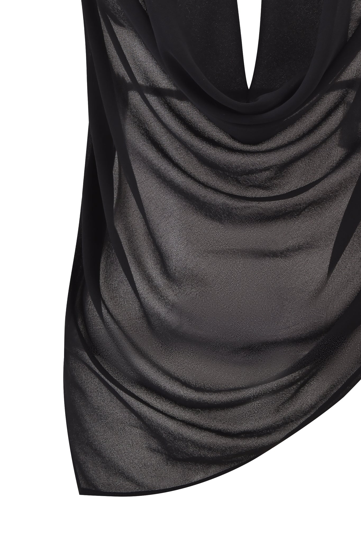 A close-up of the I.AM.GIA GRAYSON TOP - BLACK, featuring sheer black georgette with soft folds and an asymmetrical hemline. The lightweight, slightly shiny material creates an elegant look against a white background.